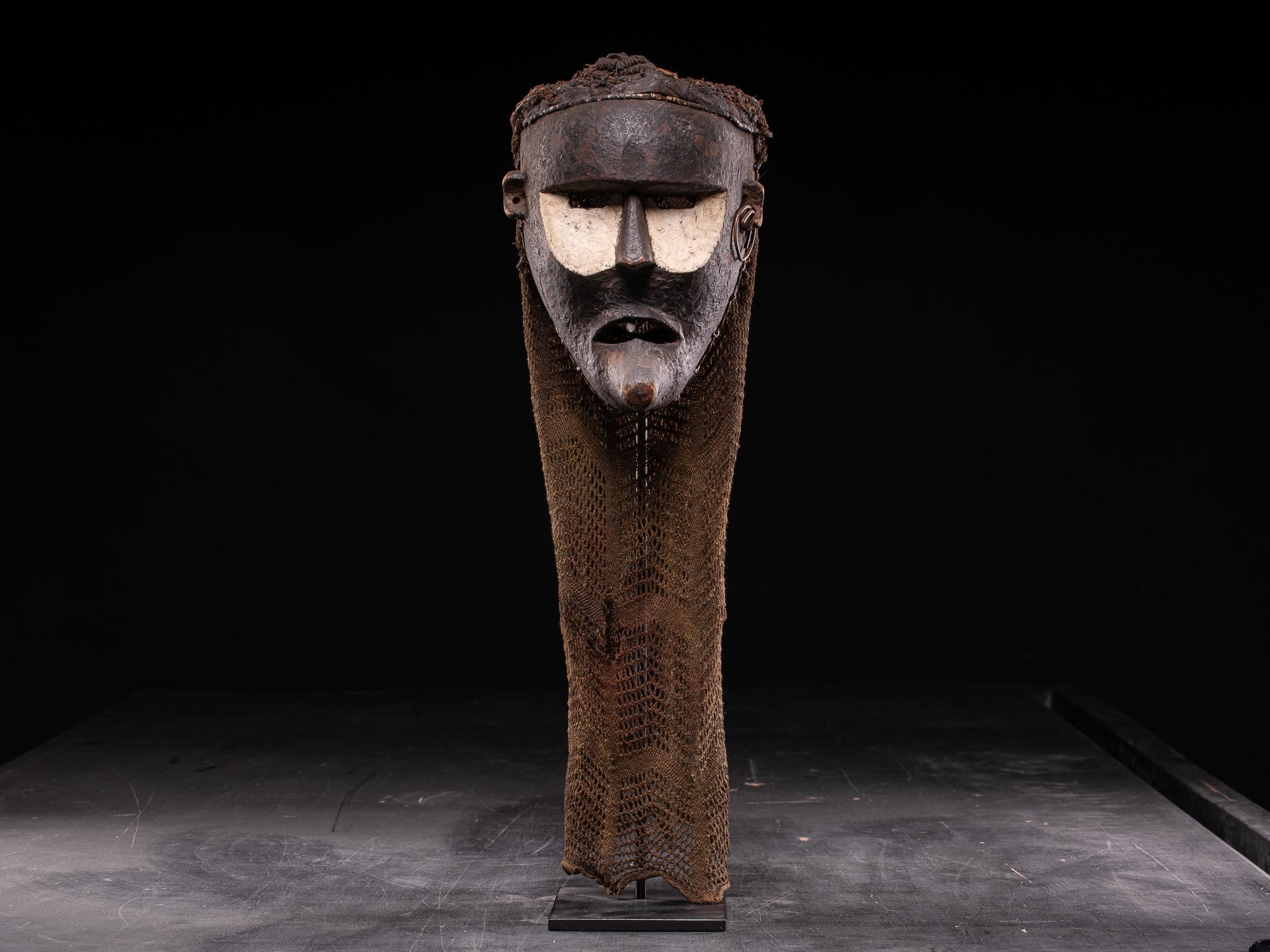 This unusual Chokwe mask is probably Katoyo, representing non-Chokwe individuals. The deviation of the mask from the more common Chokwe masks is mainly because they represent Portuguese or European features: a long European-like angular face; a
