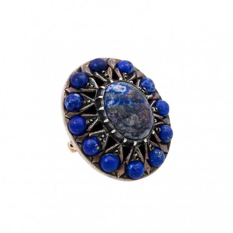 Cabochons set in silver, ring made of GG 18K, 15 g, RW: 56, 20th century, slight signs of wear.

 Ethnographic ring with cabochon-cut lapis lazuli set in silver, ring made of 18K yellow gold, 15 g, ring size 56, 20th century, minor signs of wear.