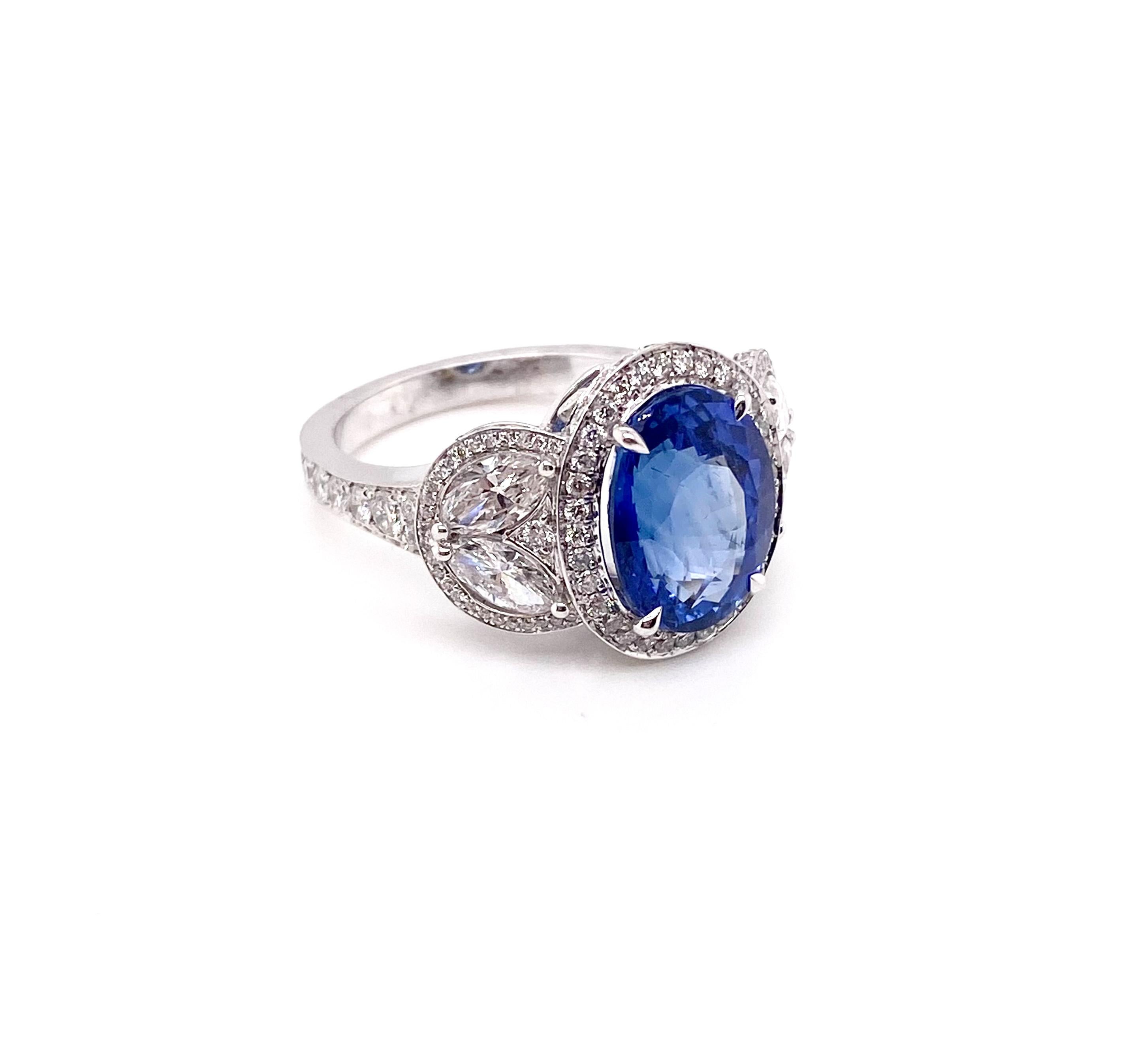 Luxuriously stylish in every way, this elegant sapphire gemstone ring is surrounded by a halo of brilliant round diamonds framed in 18K white gold. You don't need a special occasion to present it. You can wear every days and this ring is a