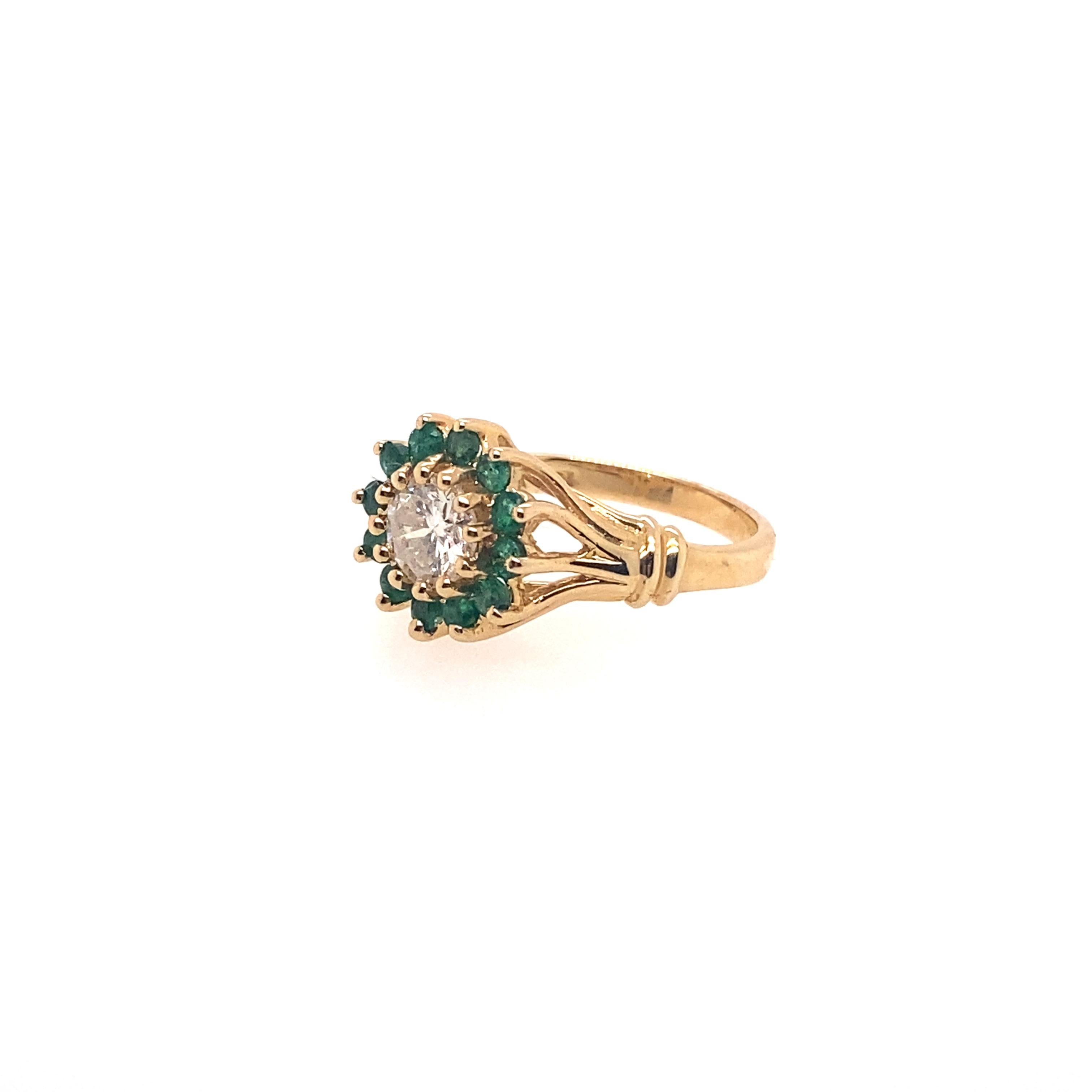 Contemporary Ethonica Emerald and Diamond Cluster Ring in 14 Karat Gold For Sale