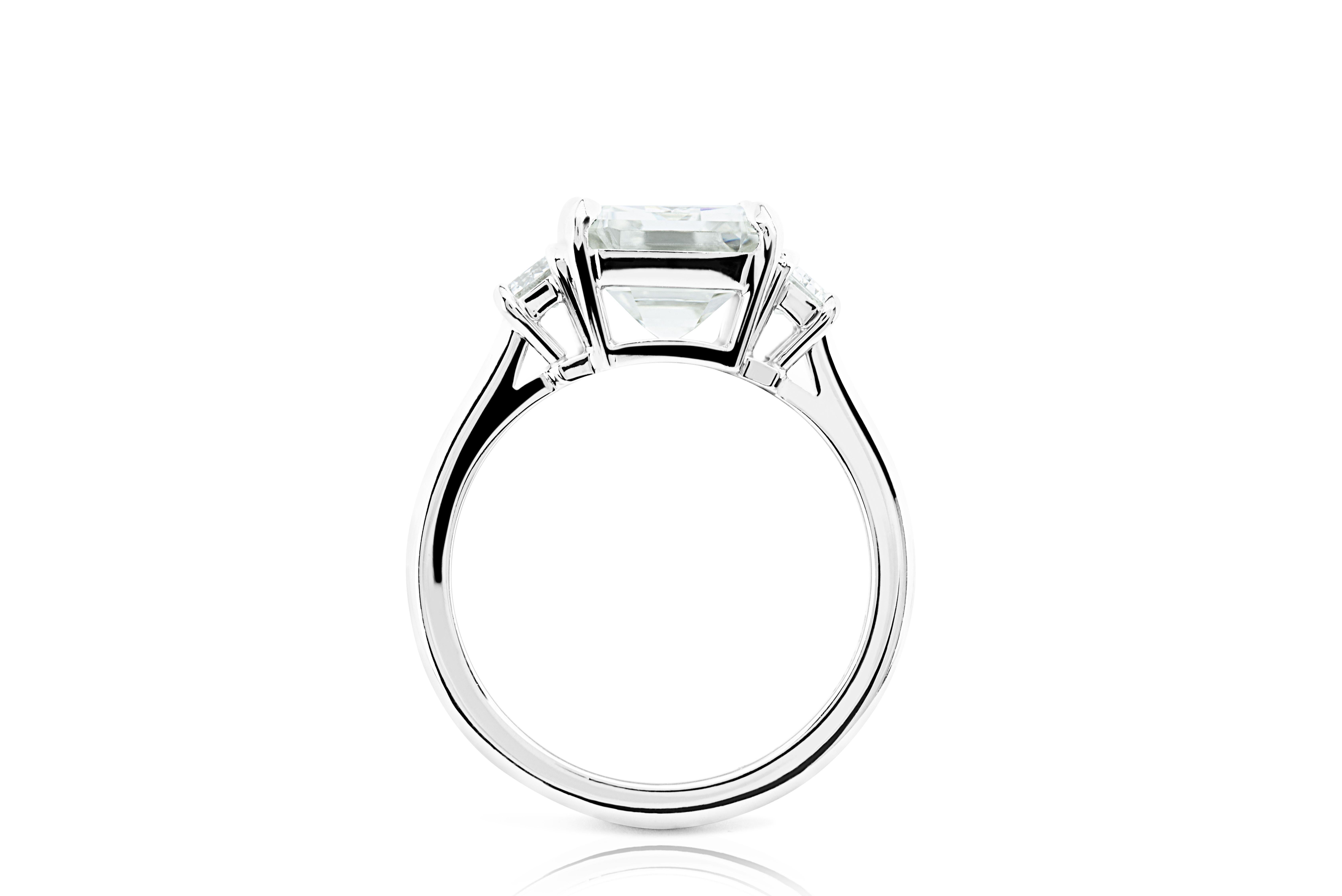 Contemporary Ethonica GIA Certified Emerald Cut Diamond Three-Stone Ring in Platinum For Sale