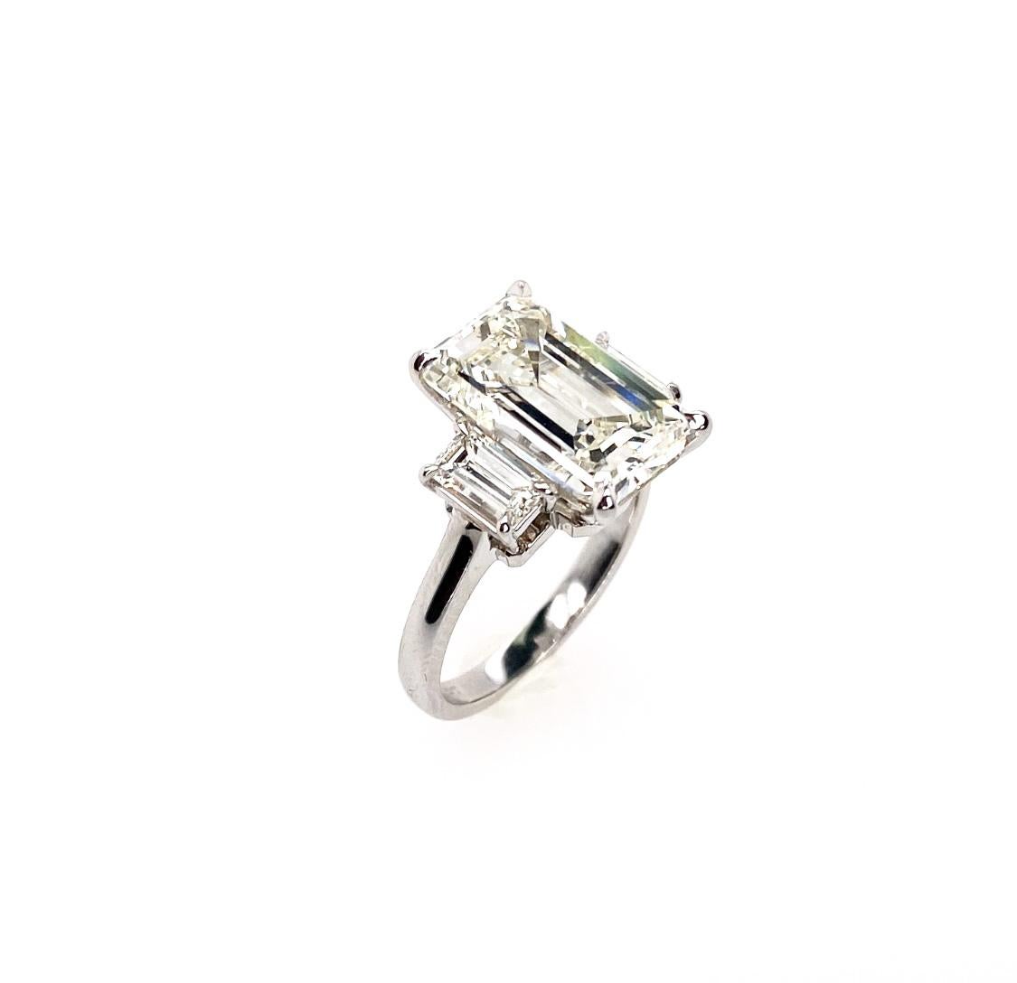 Contemporary Ethonica GIA Certified Emerald-Cut Diamond Three-Stone Ring in Platinum For Sale