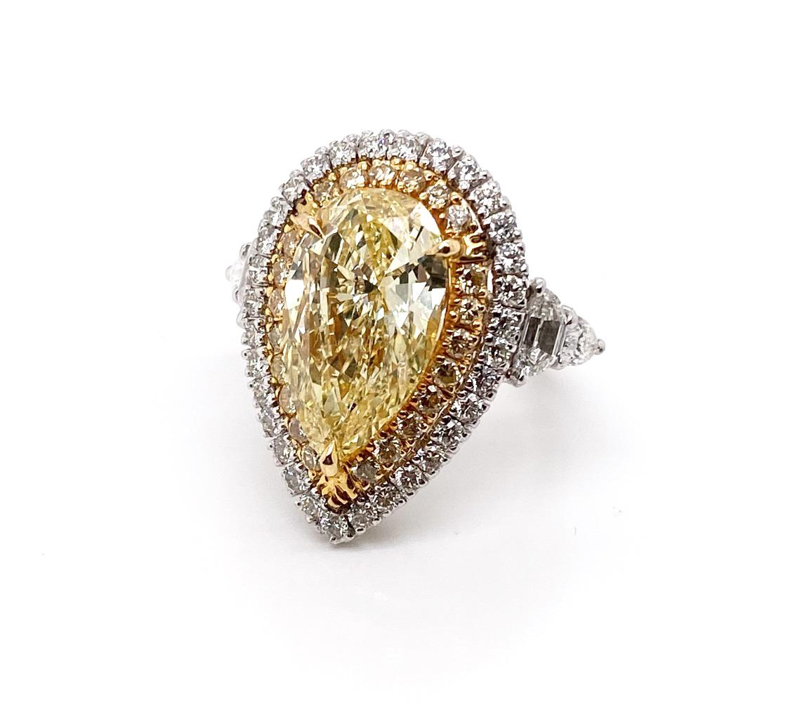 Contemporary Ethonica GIA Certified Fancy Yellow Pear Diamond Ring in Platinum