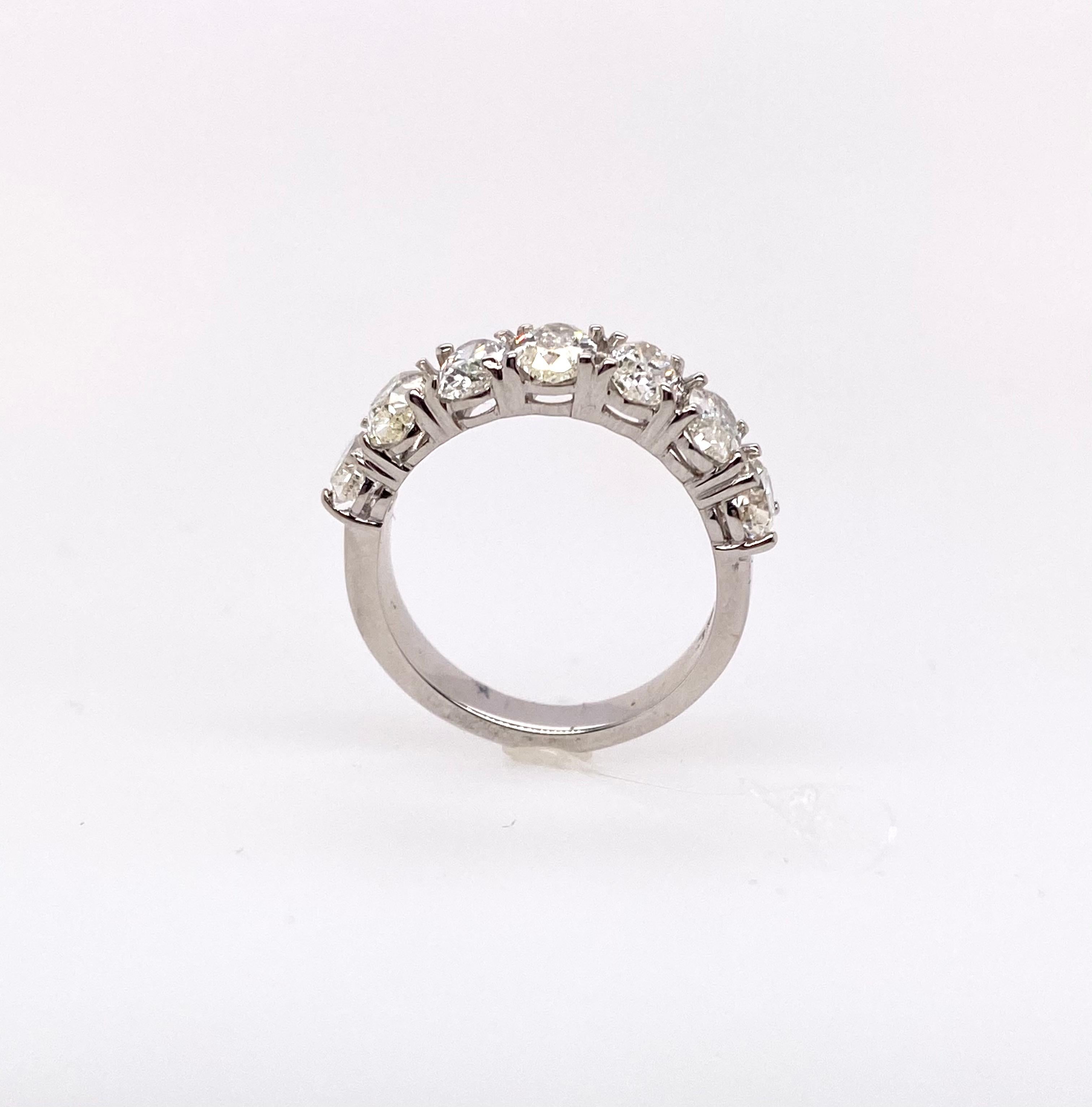 This beautiful seven-stone diamond ring features a classic statement and simple look. As a total weight of diamonds, 2.88 carat for seven oval diamonds mounted in the 18K white gold ring, beautifully. Traditional classic and timeless look. It is