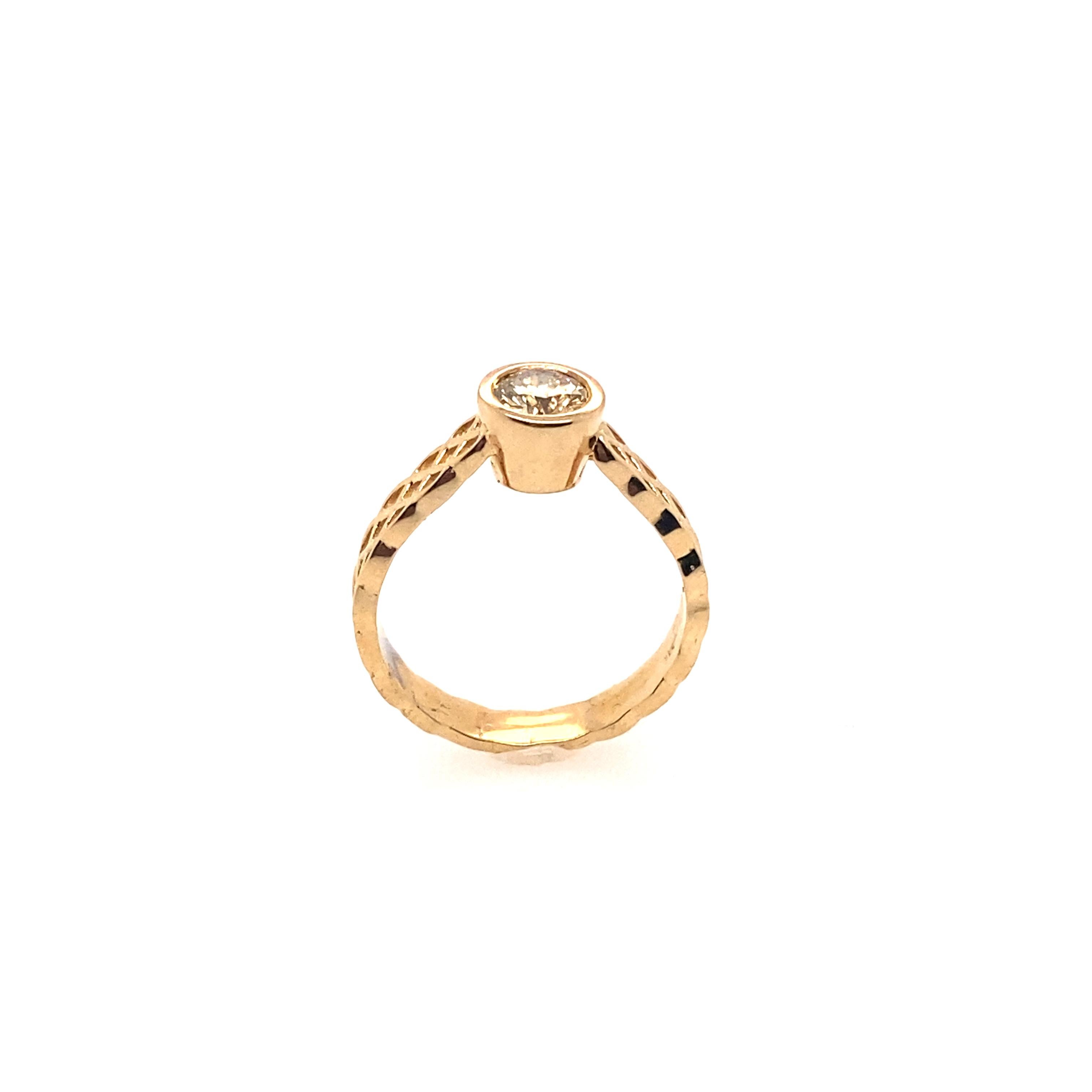 This ring features 0.60 carat fancy brown diamond set in 14K yellow gold. The band is delicate hand engraving and filigree artwork. The ring looks unique and perfect for everyday wear. 

Center Diamond Weight: 0.60 carat
Center Diamond Shape: