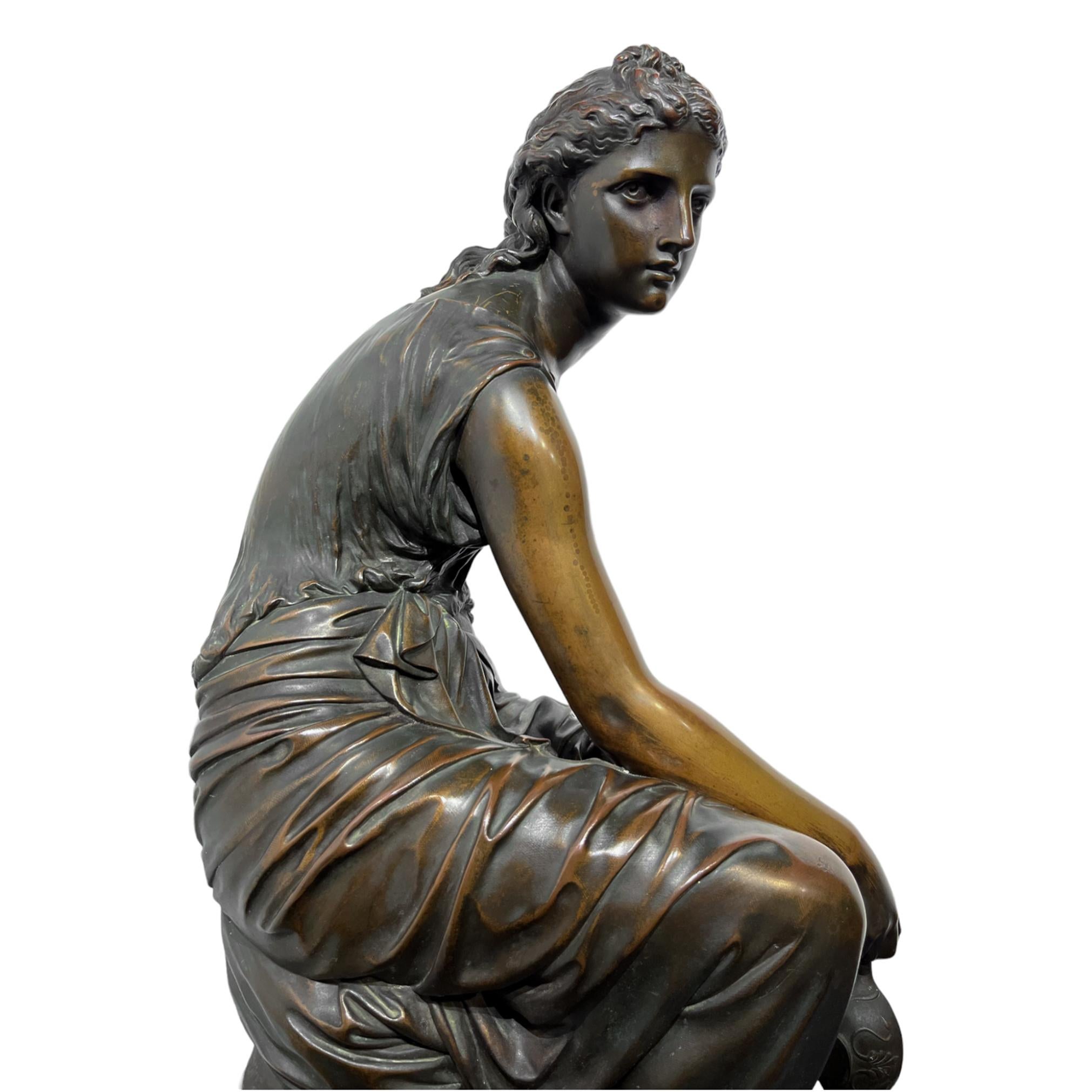 Female figural bronze by Etienne Henry Dumaige (1830-1888) of Psyche with lit Oil Lamp, perched on a stump. Her gaze is incredibly striking, commanding the eye of the viewer. The lamp dangles from her fingertips, a small lone flame emanates from the