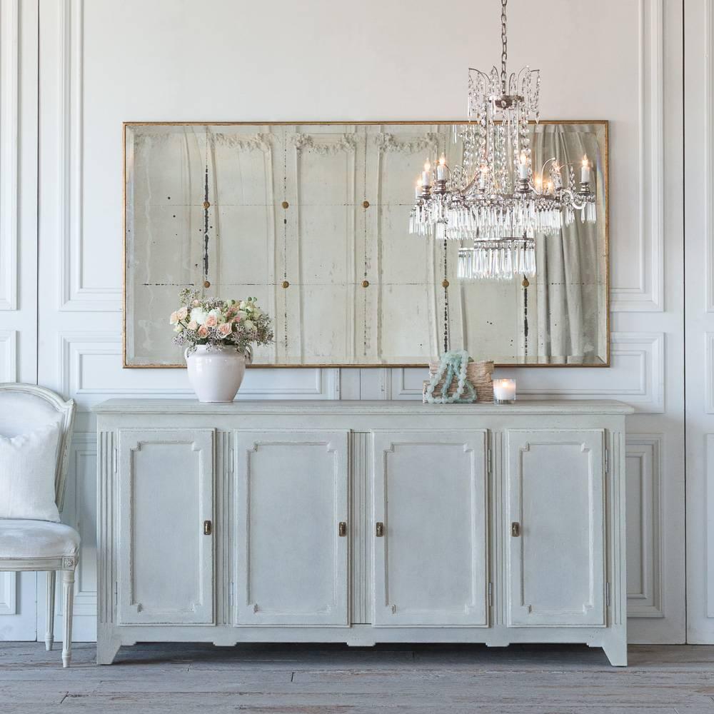 The handsome Etienne sideboard is inspired by the linear carvings and geometric profile of a French antique. A transitional piece, its functionality is surpassed only by its elegance. Two outer doors open to shelved cupboards, the center doors open
