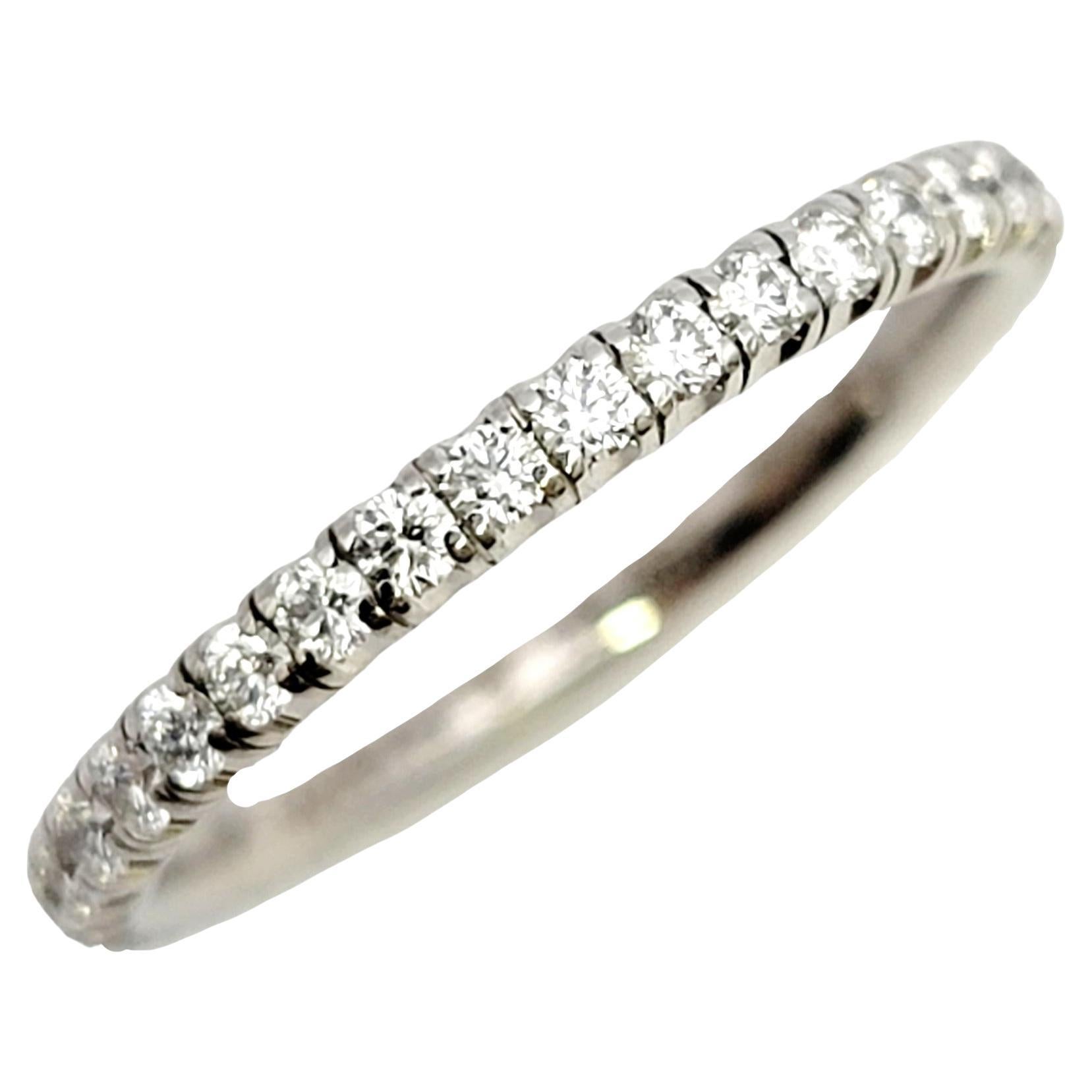 This absolutely gorgeous Etincelle de Cartier pave diamond band ring is the epitome of timeless beauty. The petite delicate paved band boasts an ultra feminine feel, while the sleek simplicity and clean lines give the ring just the right touch of