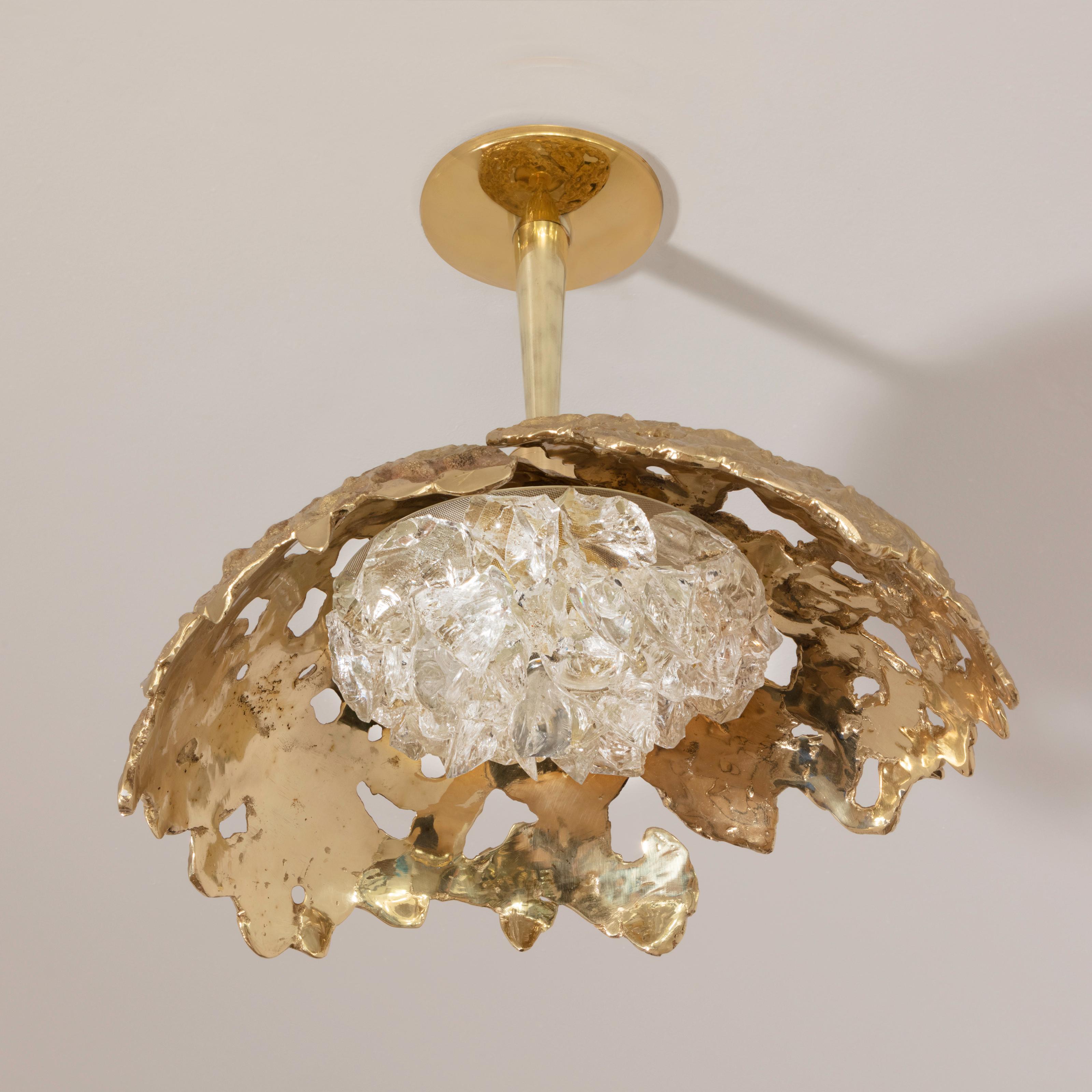 Blending sculpture and design, the N.15 is the intermediate fixture of the Etna series with a glass shade composed of dozens of crystal elements. The organic cast brass shell culminates in a polished stem and canopy. Shown in polished brass with