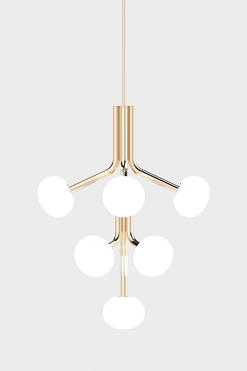 The graceful Etoile collection is composed of curved limbs providing a soft glow from the sand blasted, hand blown glass shades. The drop and stems are finished in either polished brass or nickel, or matte black.