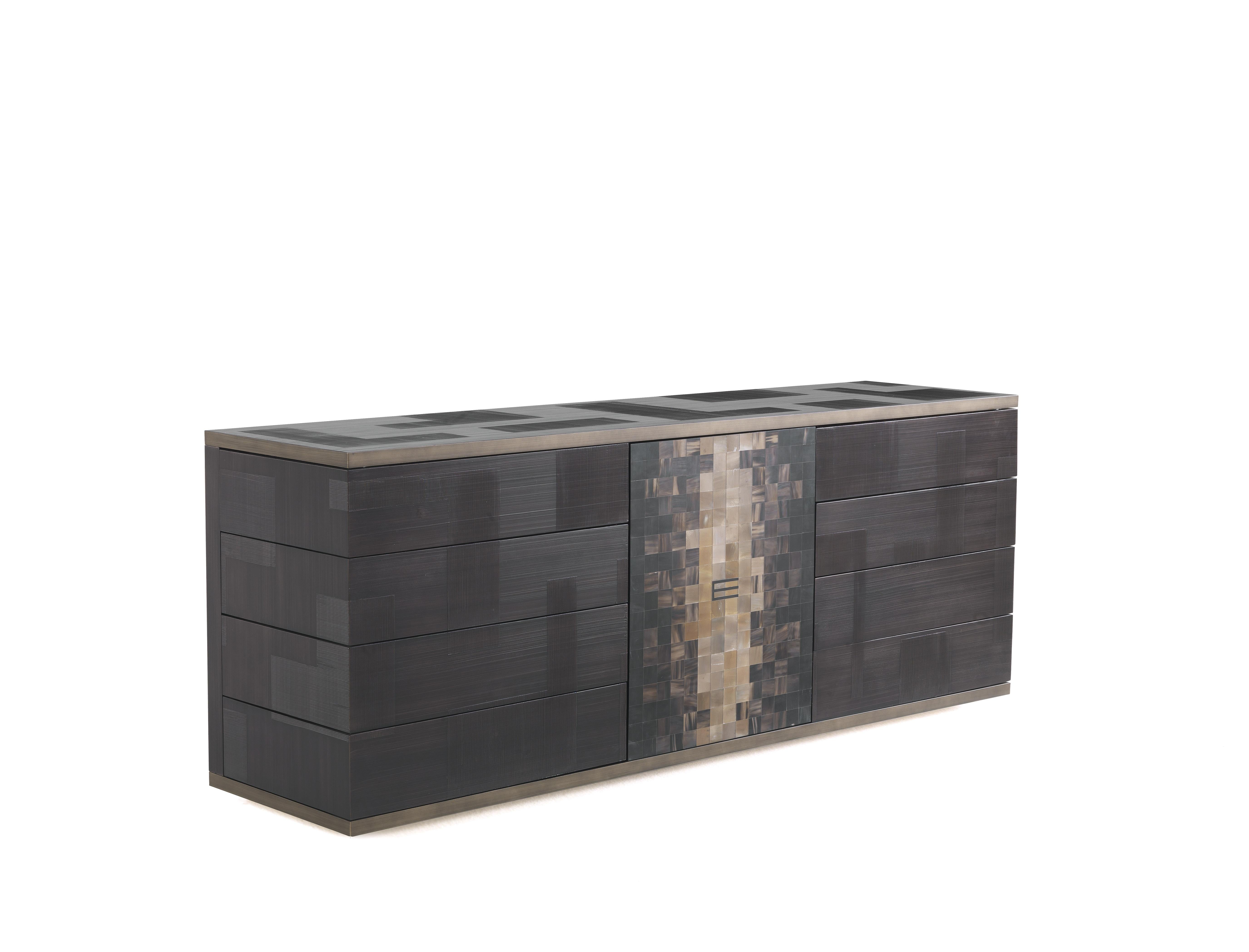The new glossy dark wengé spatula finish lending a rough effect to the piece is one of the main features of the Aleppo sideboard, a contemporary piece of furniture able to withstand trends thank to its timeless ethnic inspiration, confirmed by the
