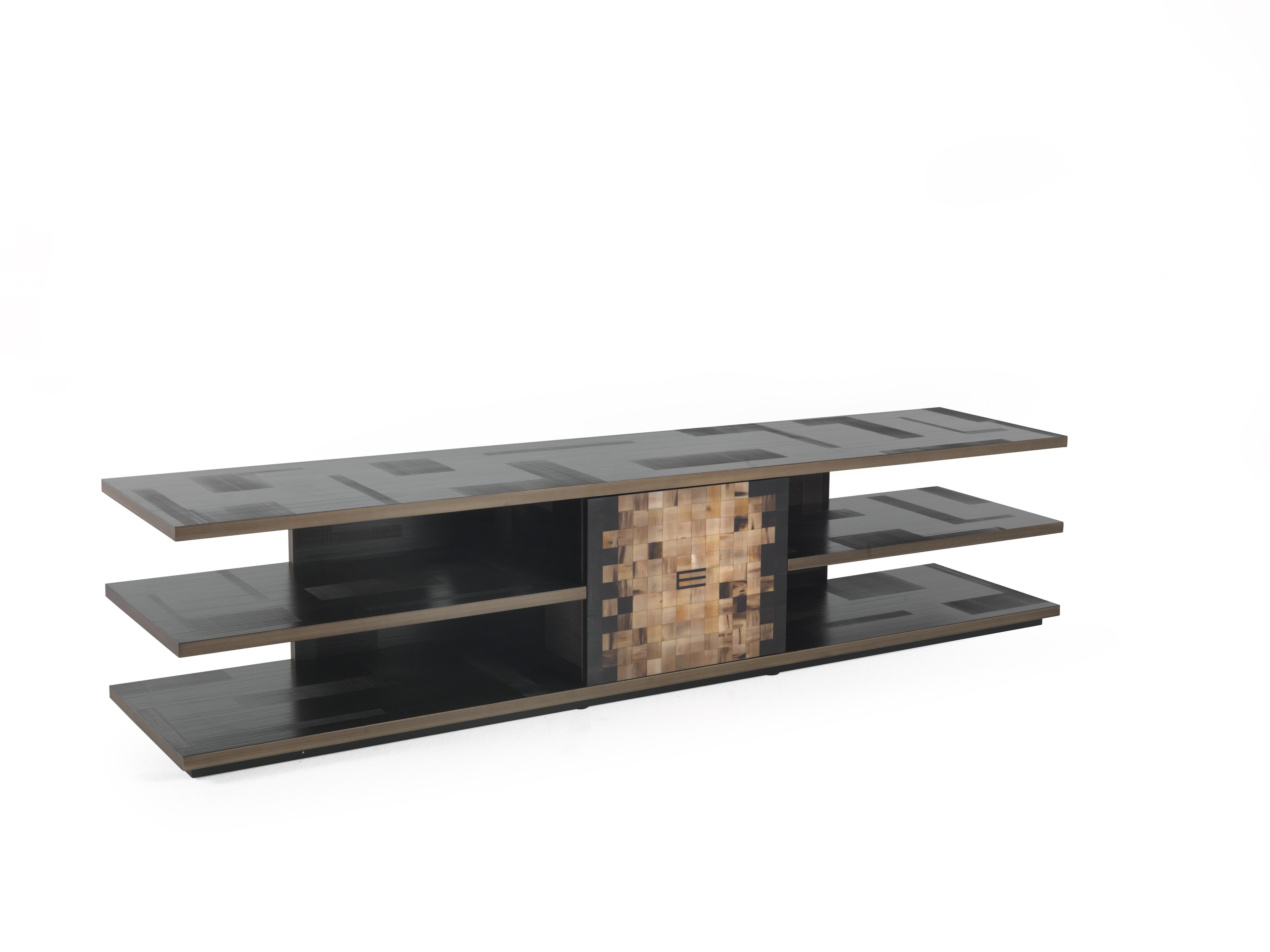 Outstanding craftsmanship, ethnic inspiration and simplicity of the lines: the Aleppo tv holder, with its structure, top and shelves in wood with glossy dark wengè spatula finish is enriched with profiles in patinated bronzed wood and central door