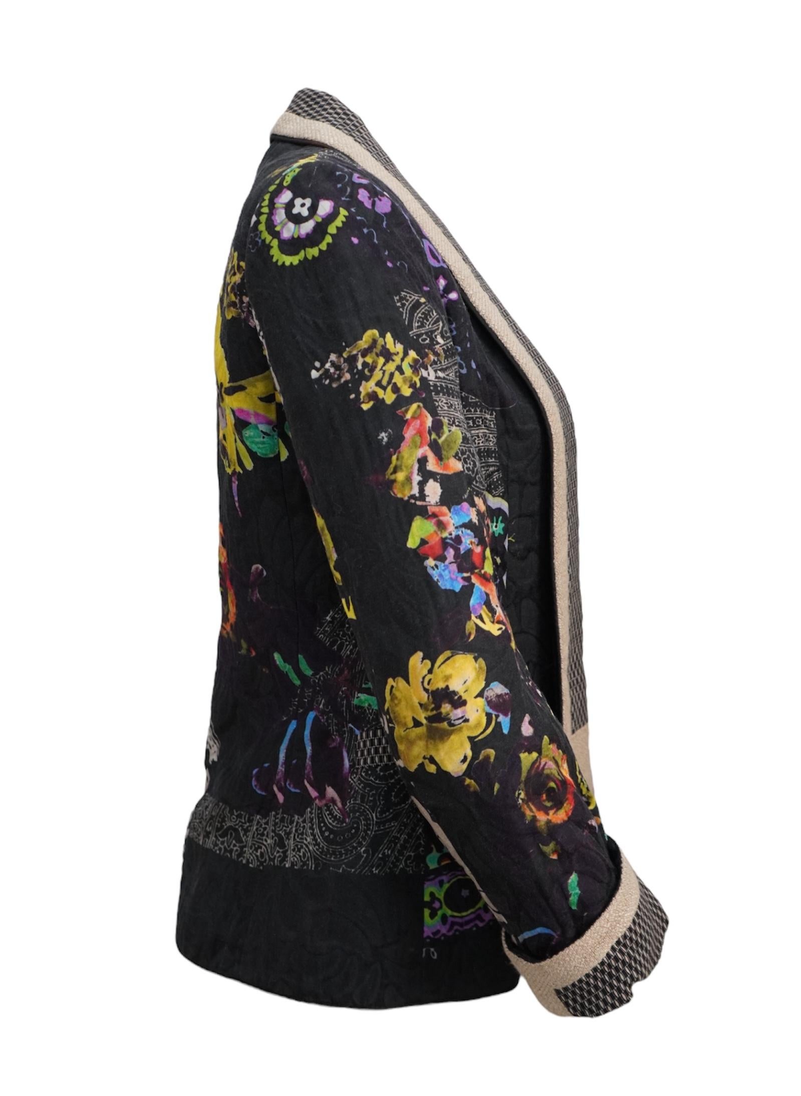Beautifully made in Italy, this size 40 Etro Blazer is filed with details. A mix of floral and paisley, in a mix of color. With the base color blazer in the color black, and total length: 25”. Detailed trim along the collar, sleeves, and faux