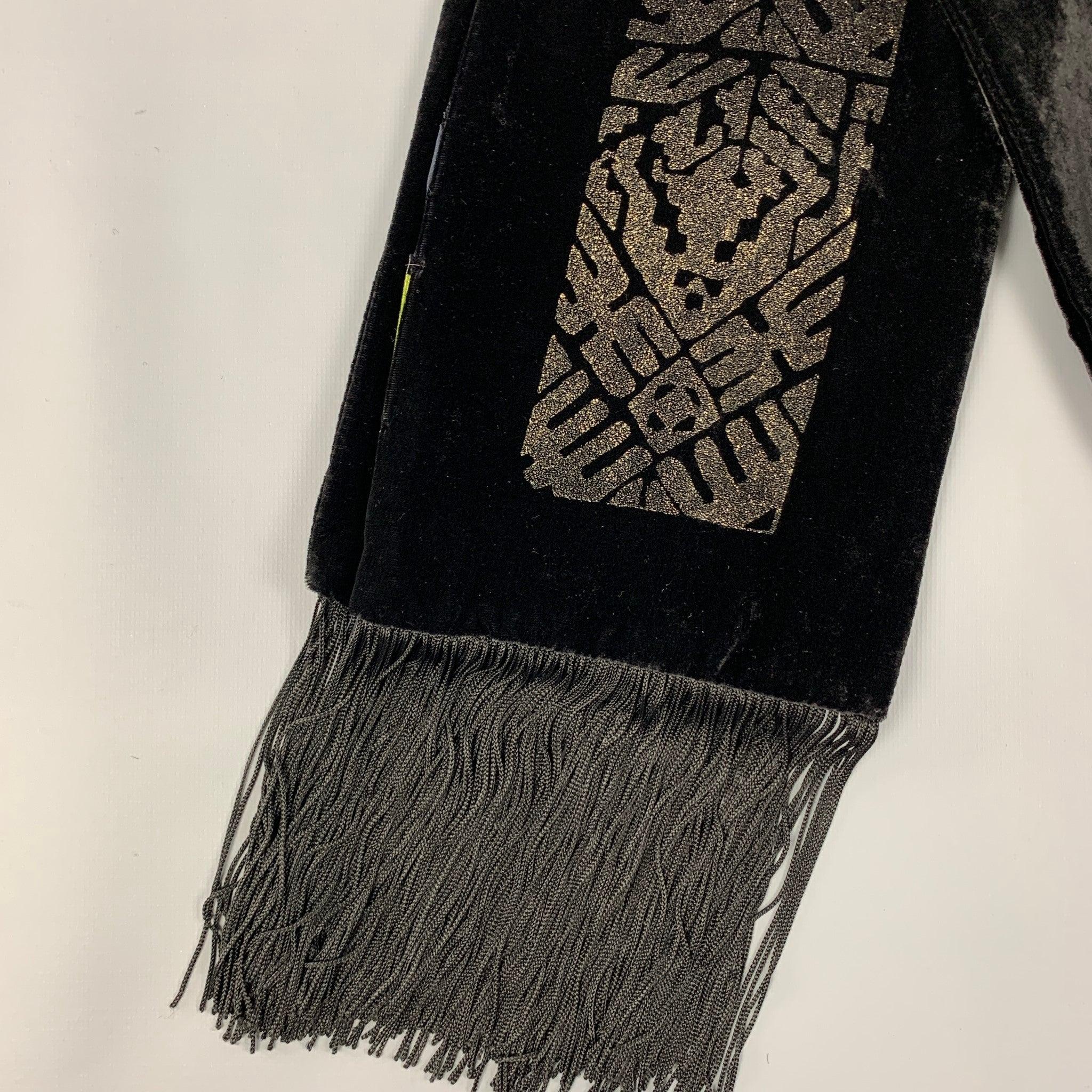 ETRO scarf comes in a black viscose / silk velvet featuring a glitter print design and a fringe trim. Made in Italy.
 Very Good Pre-Owned Condition. 
 

 Measurements: 
  
 74 inches x 6.5 inches 
  
  
  
 Sui Generis Reference: 120708
 Category: