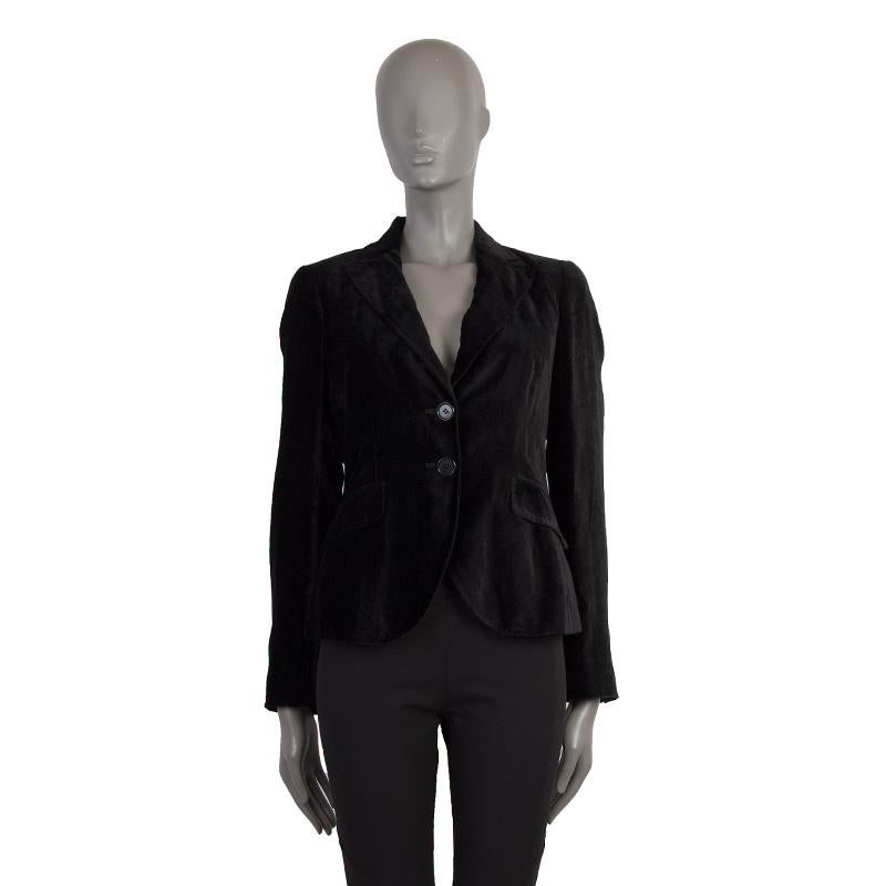 authentic Etro velvet blazer in black fabric. With notch collar, two front flap pockets, buttoned sleeves, and slit tail. Closes with two black buttons on the front. Lined In mustard and black flocked fabric.. Has been worn and is in excellent