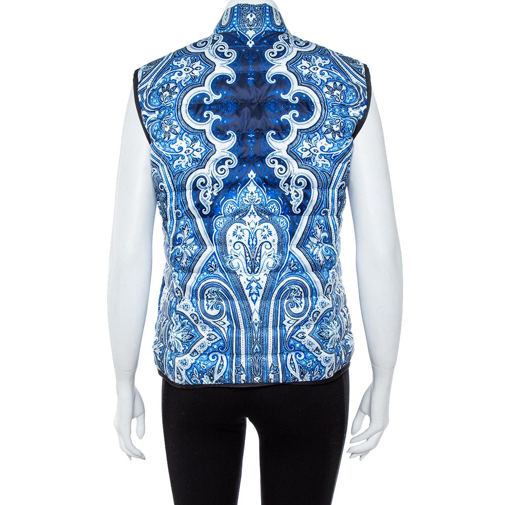 Give your closet a fabulous addition with this vest from Etro. The puffer vest has been styled with quilts, a front zipper, and paisley prints all over. It features a zip closure and sleeveless design.

Includes: Price Tag