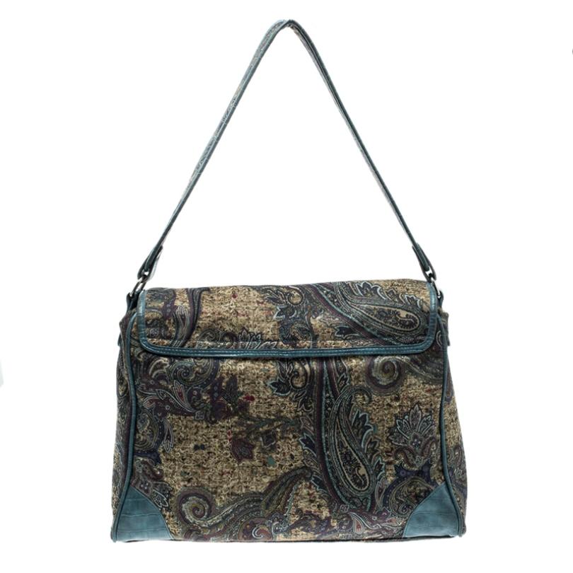 This shoulder bag with medium length handle is finely designed by Etro that is versatile to be carried with formal as well as casual outfits. Its colourful paisley print is well maintained on the high-quality canvas. The flap over it can be closed