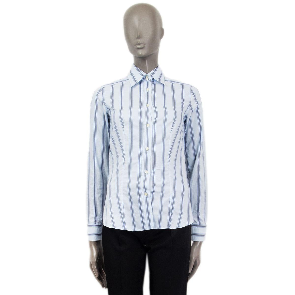 100% authentic Etro striped button-down shirt in light blue, black and white cotton (100%) with buttoned sleeve-cuffs. Closes with two buttons at the neck and eight buttons at the front. Unlined. Has been worn and is in excellent