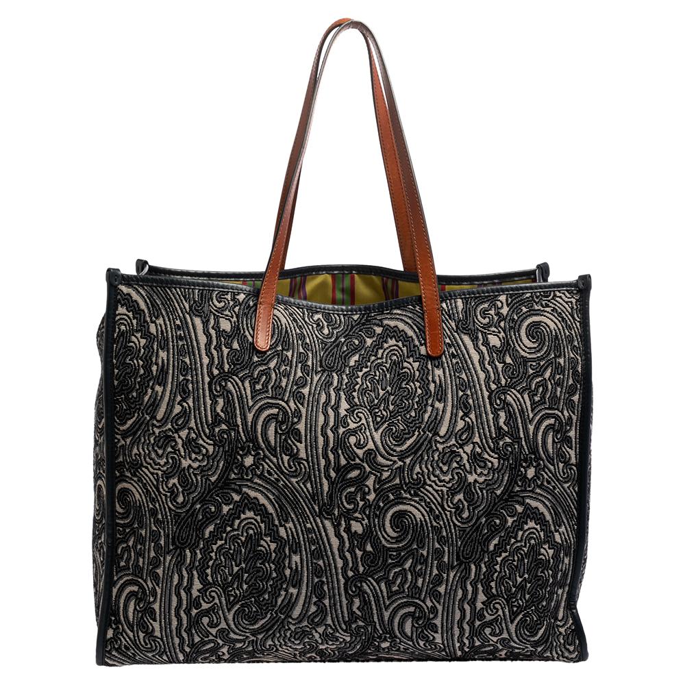 Etro is famous for prints, exceptional quality, and designs. This paisley printed tote is crafted from jacquard fabric and comes with a fabric-lined interior that will hold all your daily necessities. The bag is complete with dual handles at the