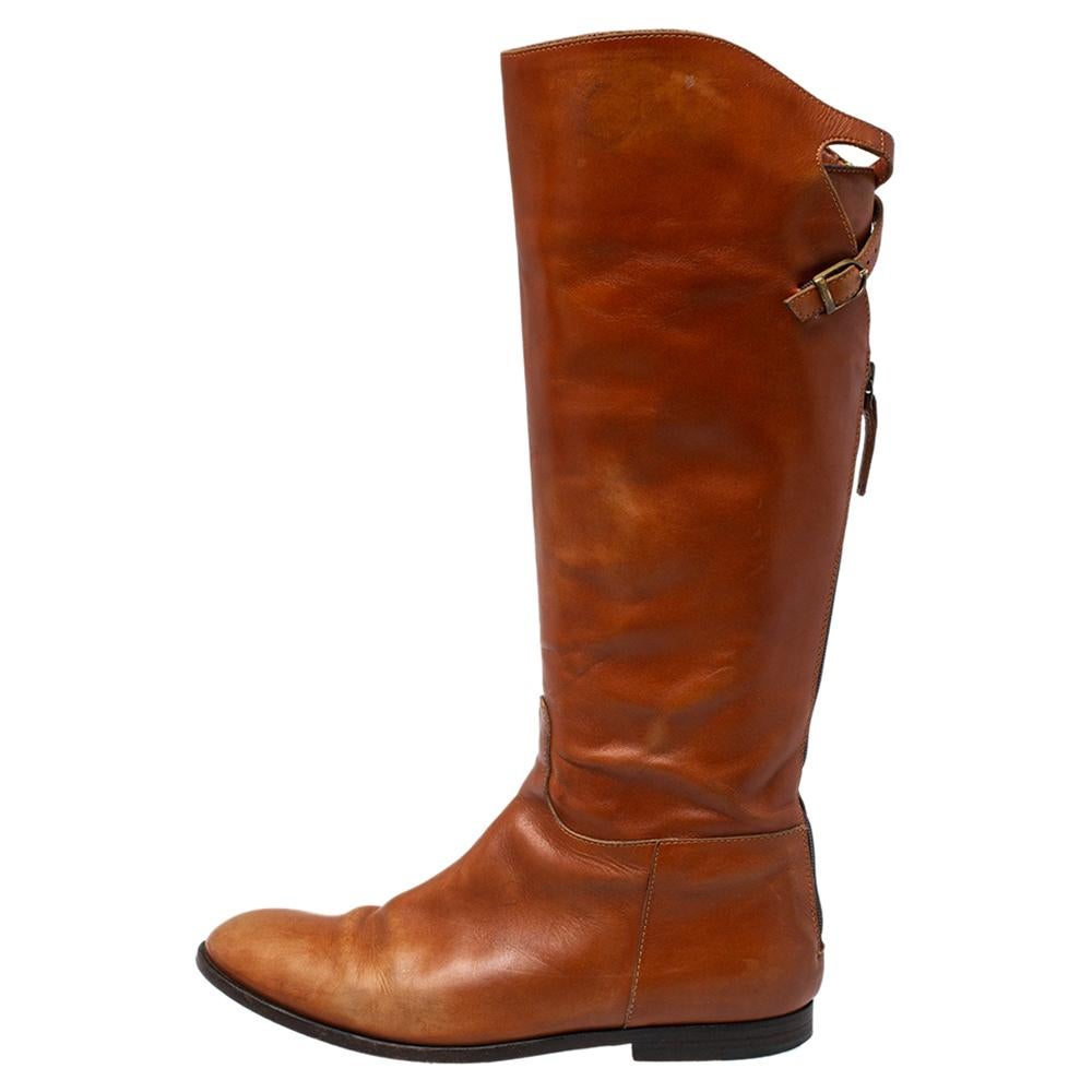 Creations as fashionable as this pair of boots from Etro deserves to be in every woman's closet. Crafted from leather in a versatile brown shade, the midcalf length of the boots are secured by rear zippers and buckles. From denim pants to dresses,