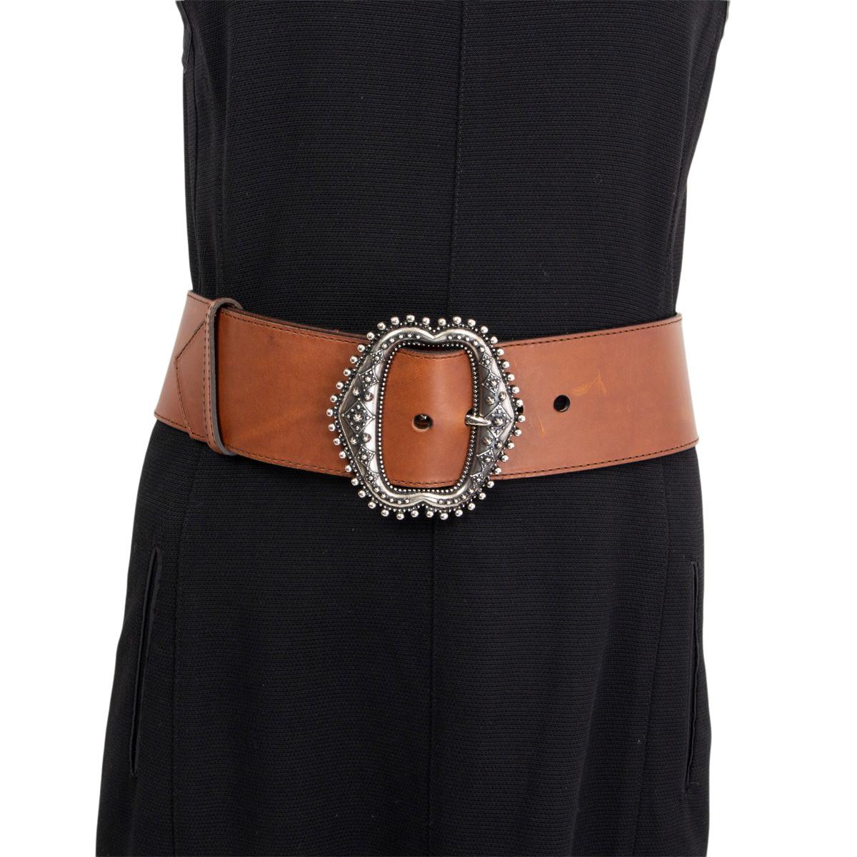 100% authentic Etro western style waist belt in brown calfskin and a buckle that's burnished in antique silver-tone metal for a vintage look and feel. Has been worn and shows some soft dents to the leather. Overall in very good condition.