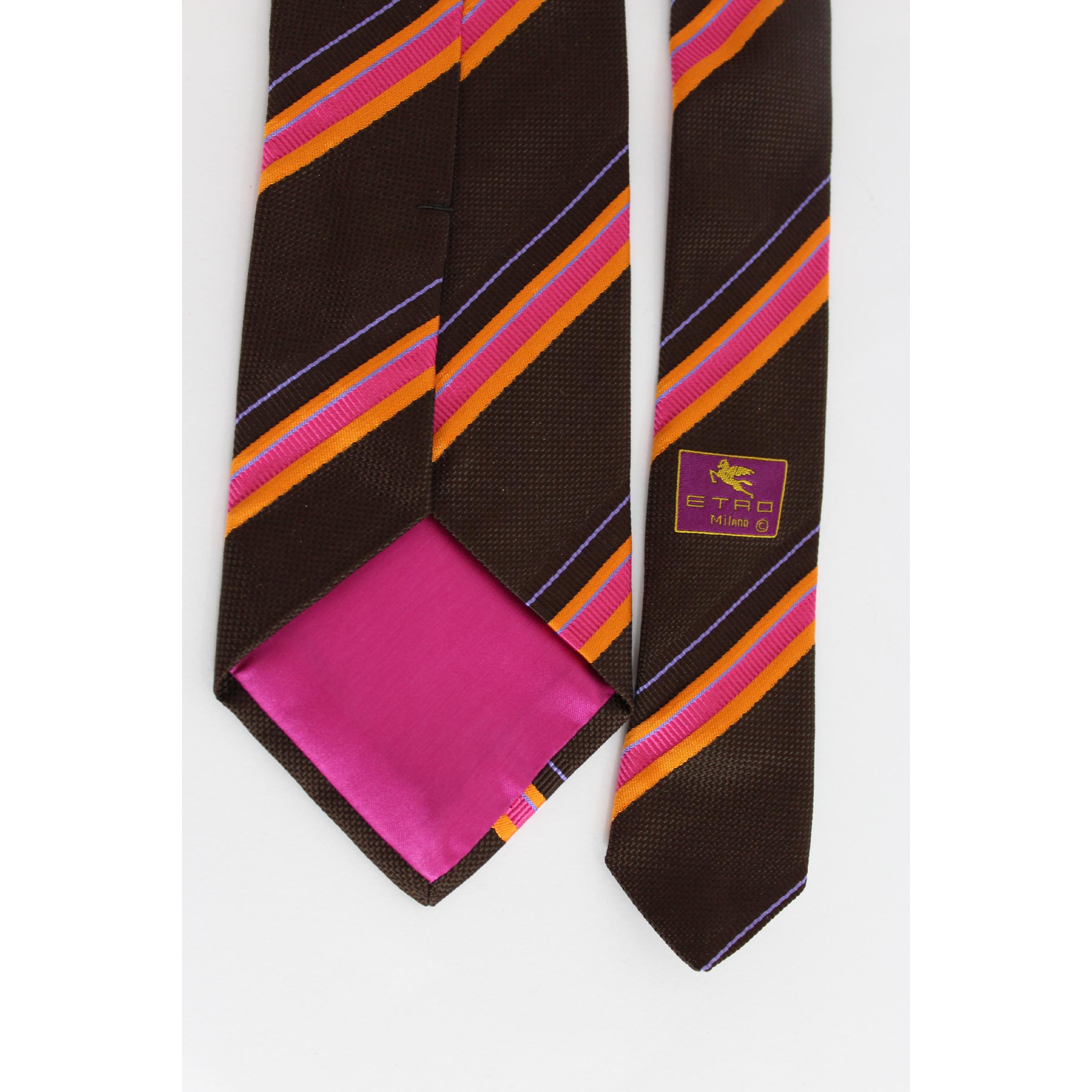 Etro vintage 90s classic tie. Striped brown and pink, 100% silk. Made italy. Excellent vintage condition.

Length: about 140 cm
Width: about 9 cm