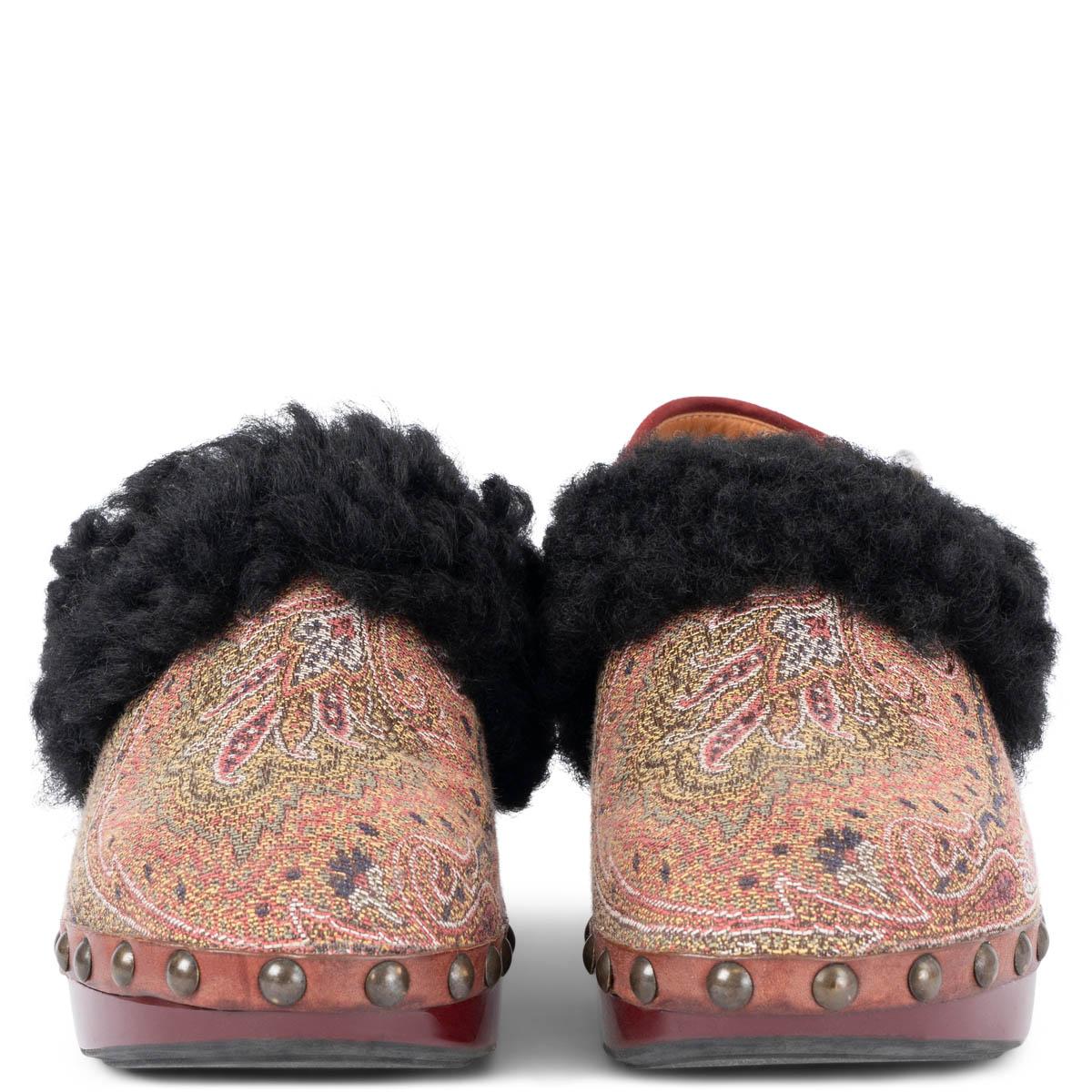 100% authentic Etro clogs in red, brown, yellow and sage green canvas with black rabbit fur trim set on a burgundy wooden sole with suede slingback. Have been worn and are in excellent condition. 

Measurements
Imprinted Size	37
Shoe