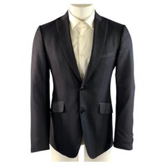 Veste de sport ETRO, tour de poitrine 42, noir et bleu marine, en jacquard de laine et soie, à revers en pointe