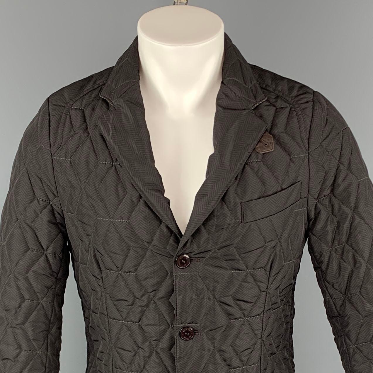 ETRO jacket comes in a brown quilted polyester featuring a notch lapel style, brown leather buttoned collar detail, three button closure, and front patch pockets. Made in Italy.

Excellent Pre-Owned Condition.
Marked: M

Measurements:

l Shoulder: