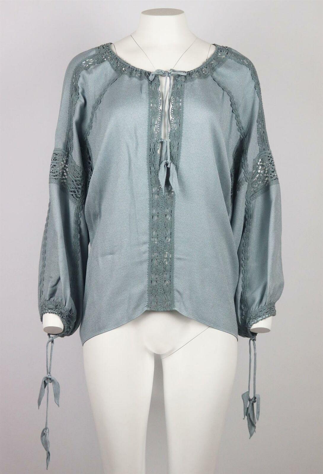 Etro's blue crepe de chine blouse was made in Italy; it is loose fitted and is finished with cotton-blend lace trims throughout and tie fastening around the neck and cuffs.
Blue crepe de chine.
Slips on.
100% Viscose; trim: 100% cotton.

Size: IT 42