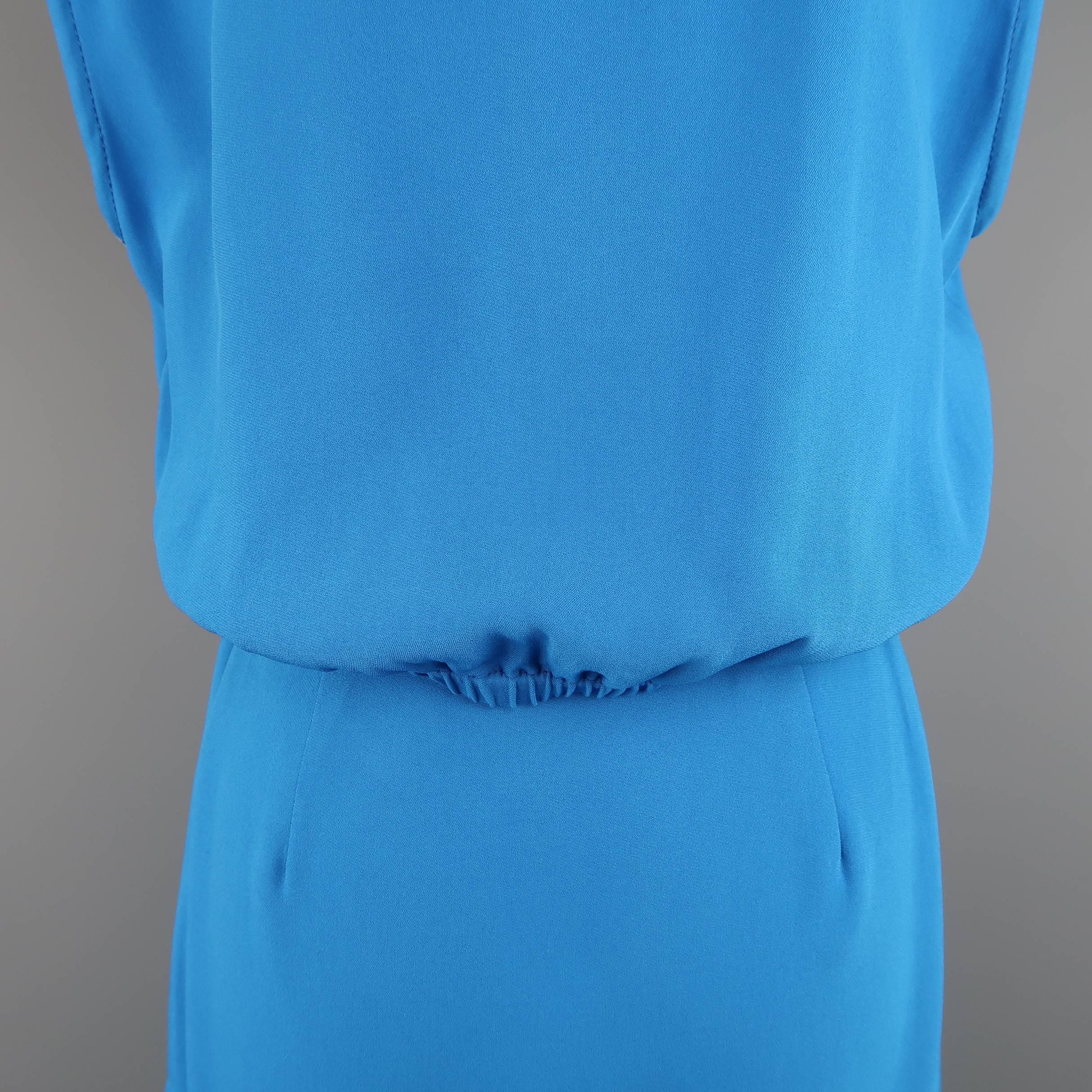 Sleeveless ETRO dress comes in aqua blue viscose blend fabric with a pointed collar, half button front, back cutout, and sash belt. Made in Italy.
 
Excellent Pre-Owned Condition.
Marked: IT 40
 
Measurements:
 
Shoulder: 19 in.
Bust: 40 in.
Waist: