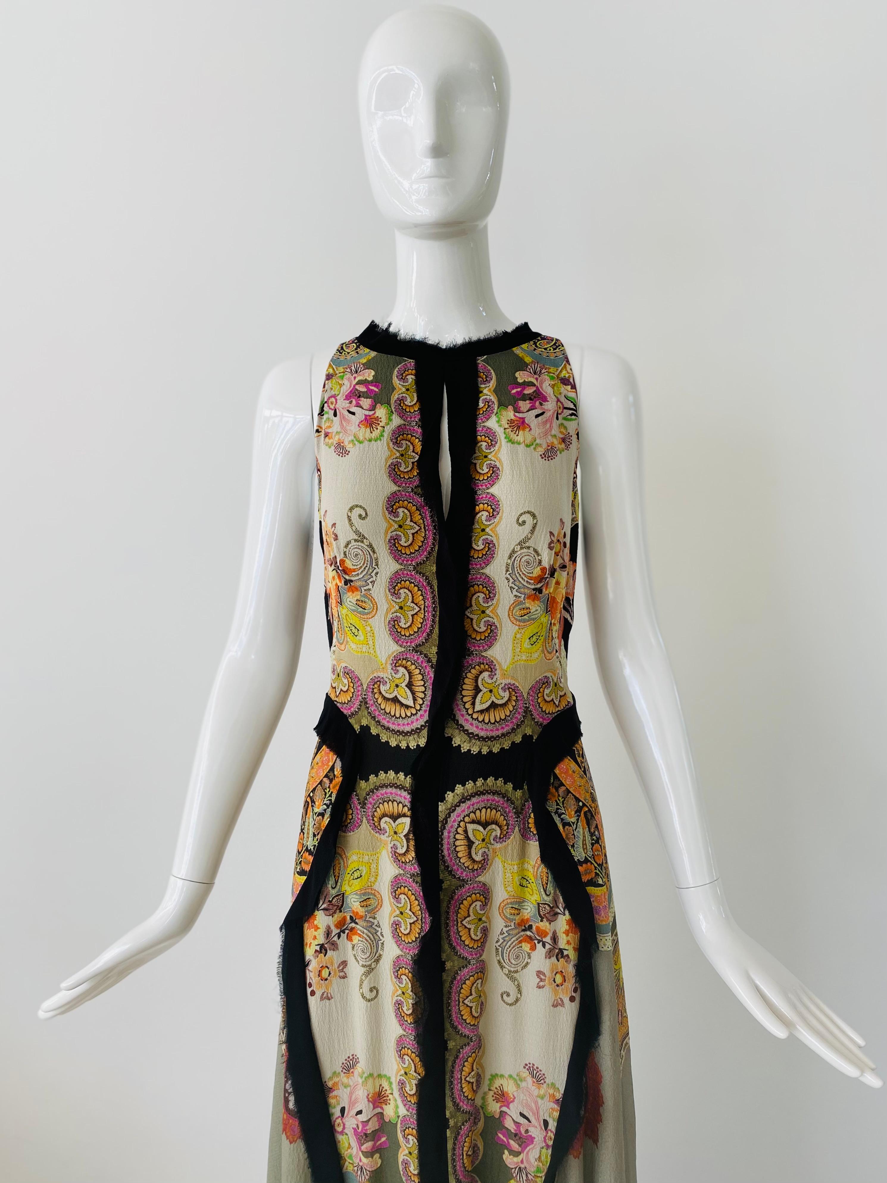 Modern Etro maxi dress in a classic Etro paisley print on soft sheer silk with multiple layers.  Raw hems of black silk that are sewn to face outwards.  There is a cut out slit in the middle of the chest and a deep v down the back.  The lightness of