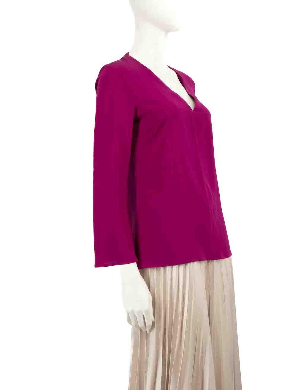 CONDITION is Very good. Hardly any visible wear to top is evident on this used Etro designer resale item.
 
 
 
 Details
 
 
 Fuchsia
 
 Silk
 
 Blouse
 
 Long sleeves
 
 V-neck
 
 
 
 
 
 Made in Italy
 
 
 
 Composition
 
 100% Silk
 
 
 
 Care