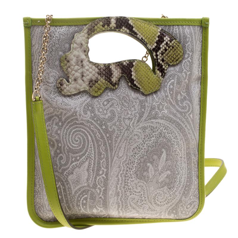 Etro's crossbody bag is crafted from coated leather with the signature grey paisley print on it. It features a unique paisley shaped leather cutout around the hand-held style. The interior is fabric lined with a side slip pocket. Completed with a