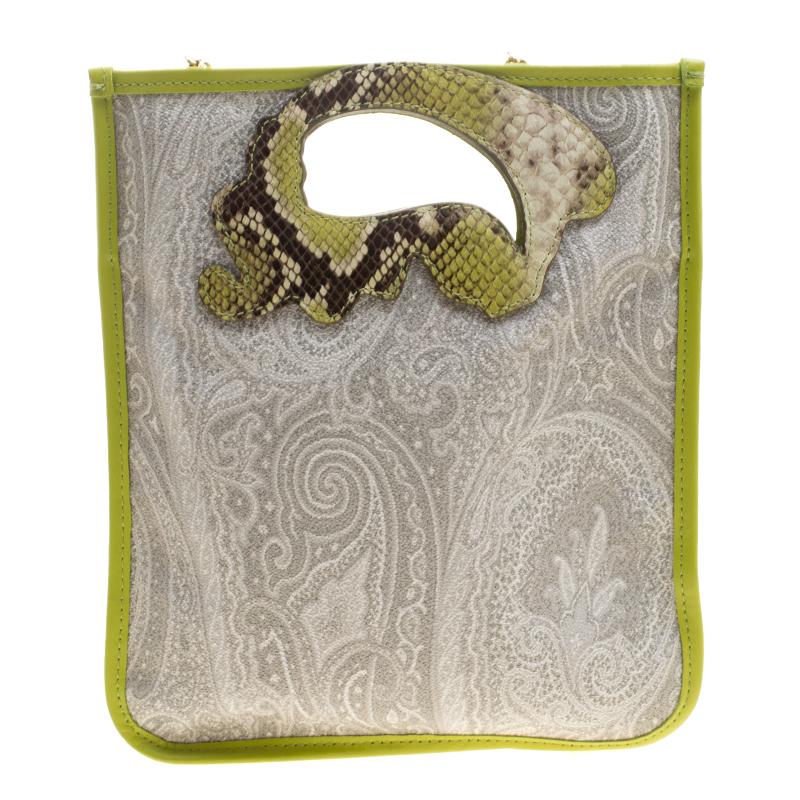 Meticulously crafted from paisley-coated canvas, this Etro bag exudes just the right amount of sophistication. The bag features green leather borders, a spacious fabric interior and a paisley-cut around the handle with python embossing. You can