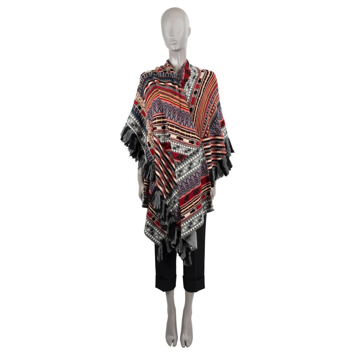 100% authentic Etro striped poncho in burgundy, grey, black, beige, white, purple, yellow and blue wool (86%), viscose (12%) and polyamide (2%) with grey and black fringed hem. Unlined. Has been worn and is in excellent condition. 

Measurements
Tag