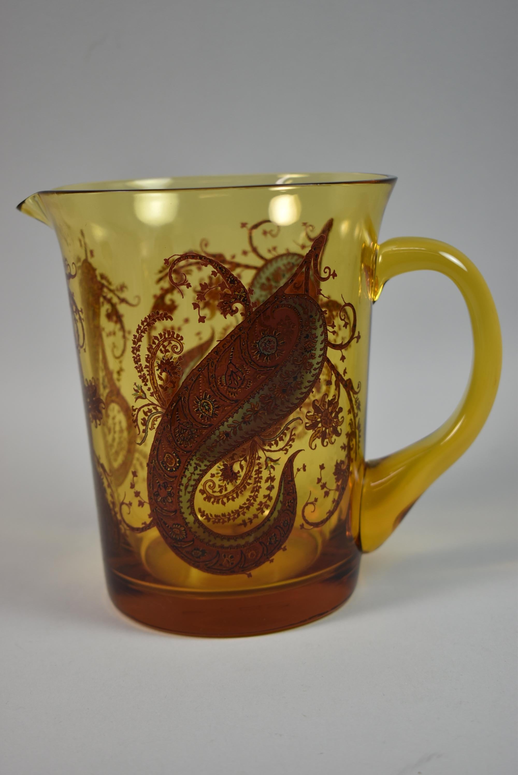 carnival glass pitcher and goblets