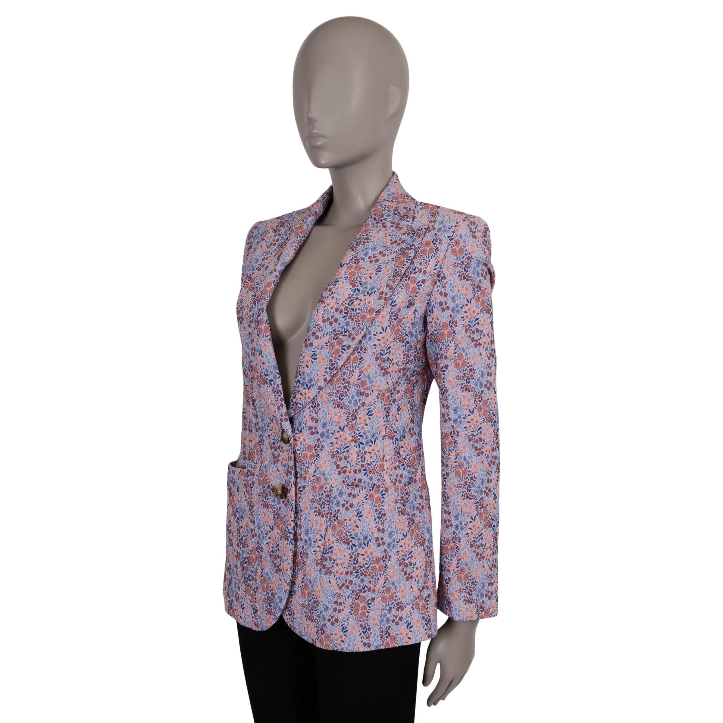 This 100% authentic Etro blazer is crafted in a light blue, pink, and brown micro floral jacquard composed of 57% polyester, 21% cotton, 20% polyamide, and 2% elastane. The tailored silhouette is elevated by oversized peak lapels and patch pockets