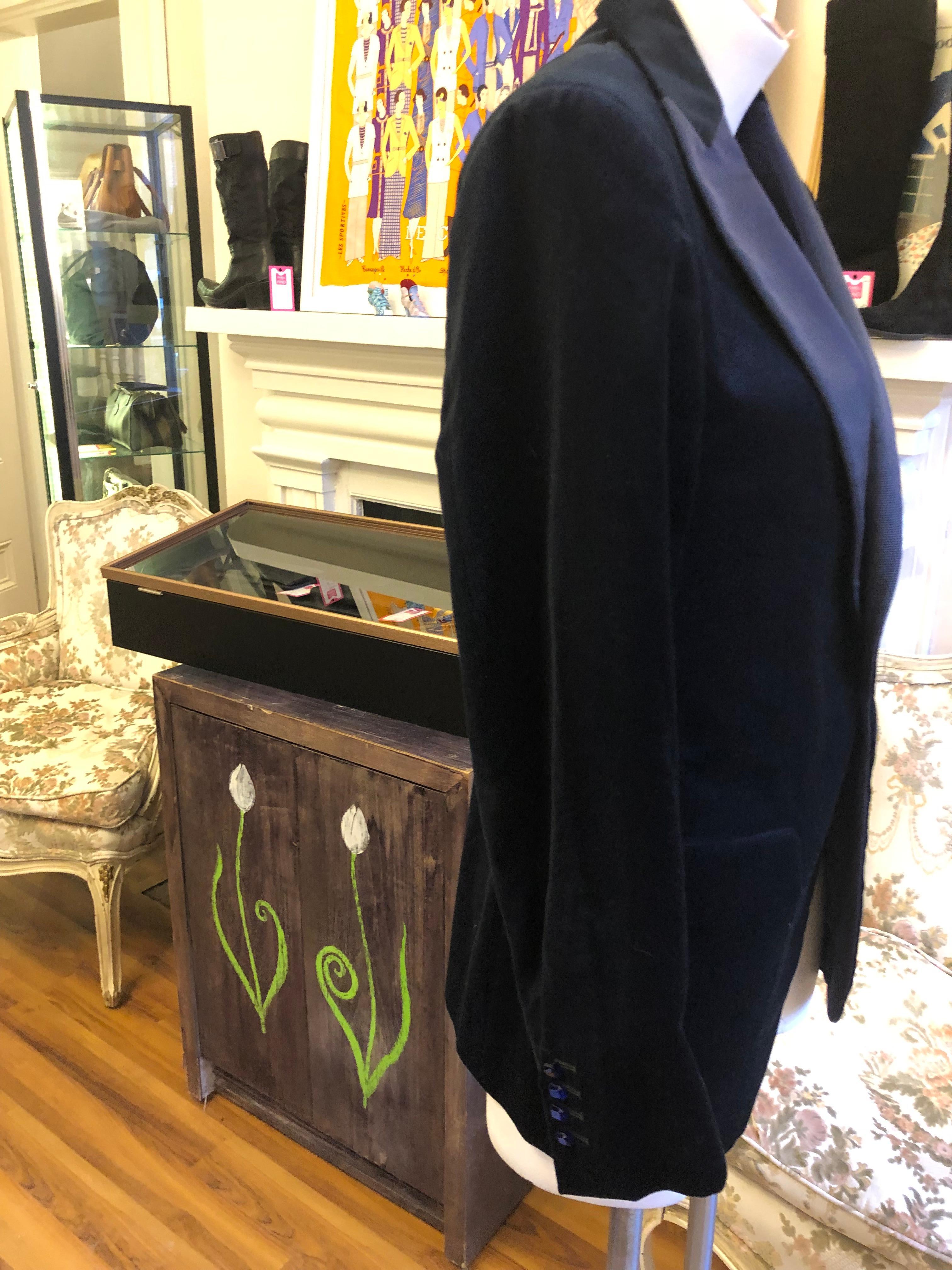 Superb textured cotton velvet tuxedo jacket with gros grain/satin lapels; silk signed paisley lining; two flap pockets and a breast pocket at the front; lining pockets; one button closure; center back vent, and EXQUISITE 