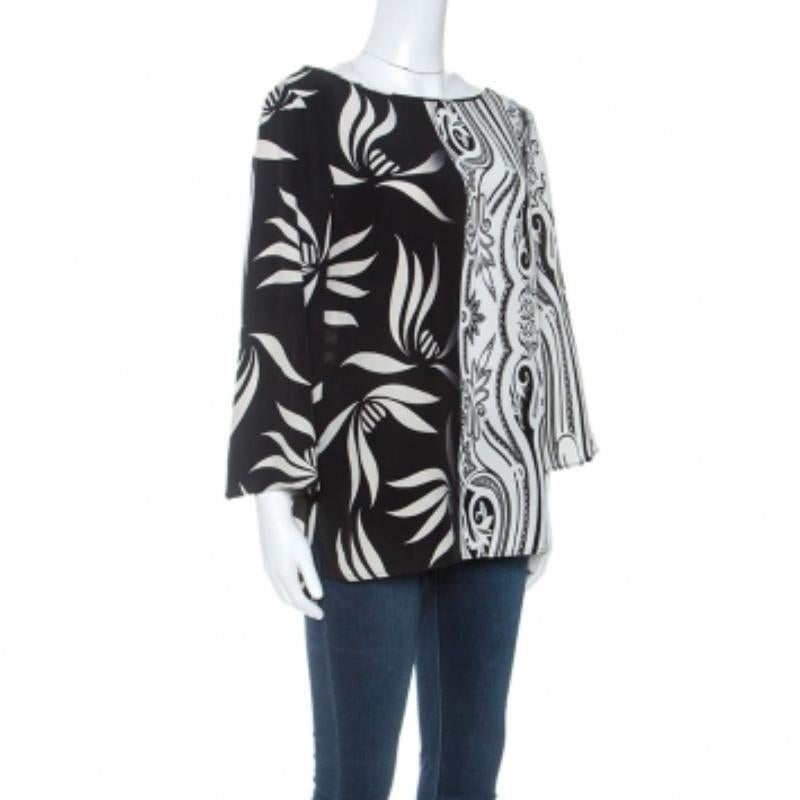 Luce un look llamativo con esta prenda chic de la casa Etro. Fabricada 100% en seda, esta lujosa prenda será tu prenda imprescindible para los eventos formales. Presenta un estampado monocromático de cachemira y hojas por toda la prenda. Se ha