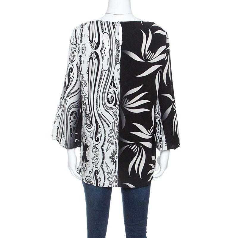 Expect statement looks with this chic piece from the house of Etro. Made from 100% silk, this luxurious piece will be your go-to for formal events. It features a monochrome paisley and leaf print throughout. It has been cut to deliver a relaxed