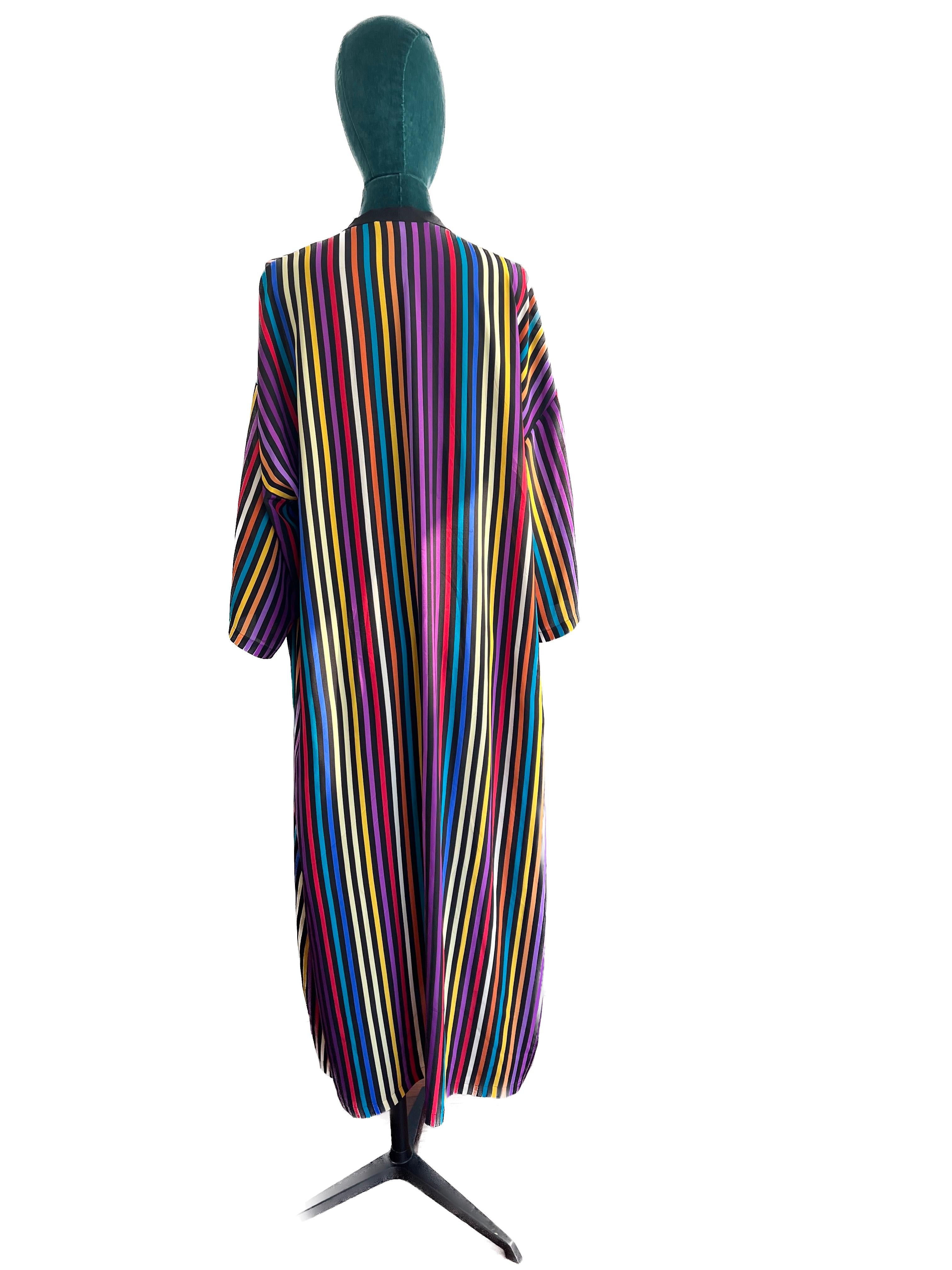 Embrace the artistry of Italian fashion with the Etro Multicolor Stripe V-Neck Silk Kaftan, a vibrant and luxurious piece that effortlessly combines timeless elegance with a contemporary twist. This exquisite kaftan is a celebration of color,