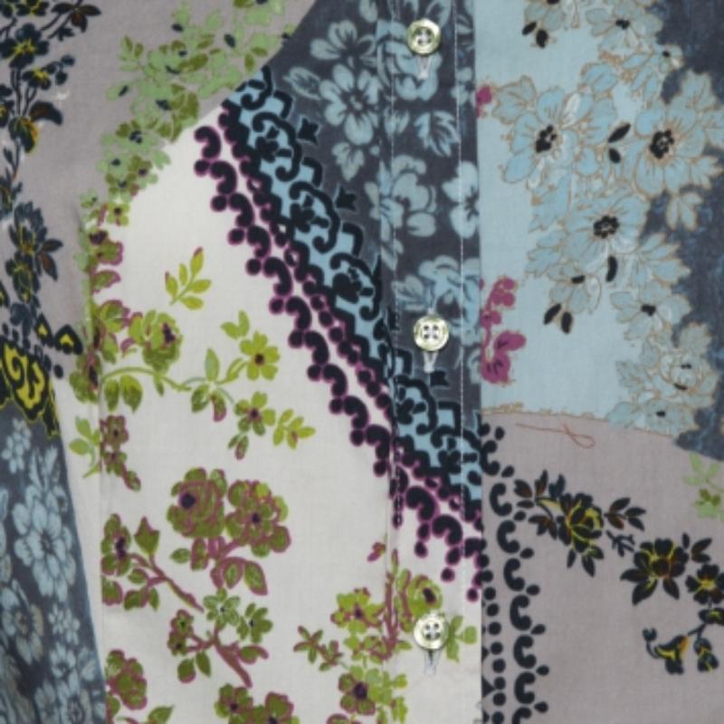 Effortlessly stylish and feminine, this Etro shirt is great for casual days. Crafted from a cotton blend, it carries multicolored hues and flaunts a floral print throughout. It has a relaxed silhouette, long sleeves, a collar, and a button front. It