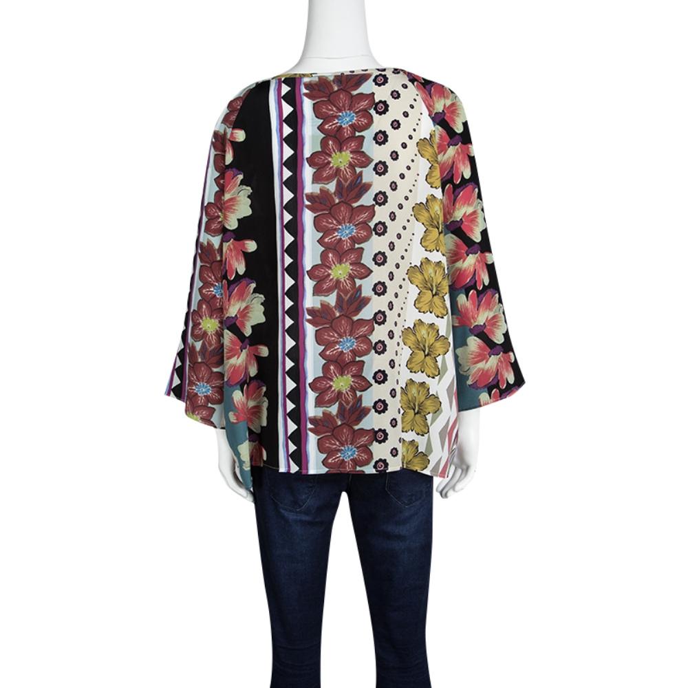 Easy-breezy and fashionable, this Etro blouse is tailored in silk for a relaxed fit. It features a multicolour floral print all over and comes with full sleeves. It is detailed with subtle pleats along the neckline that adds a structure to the