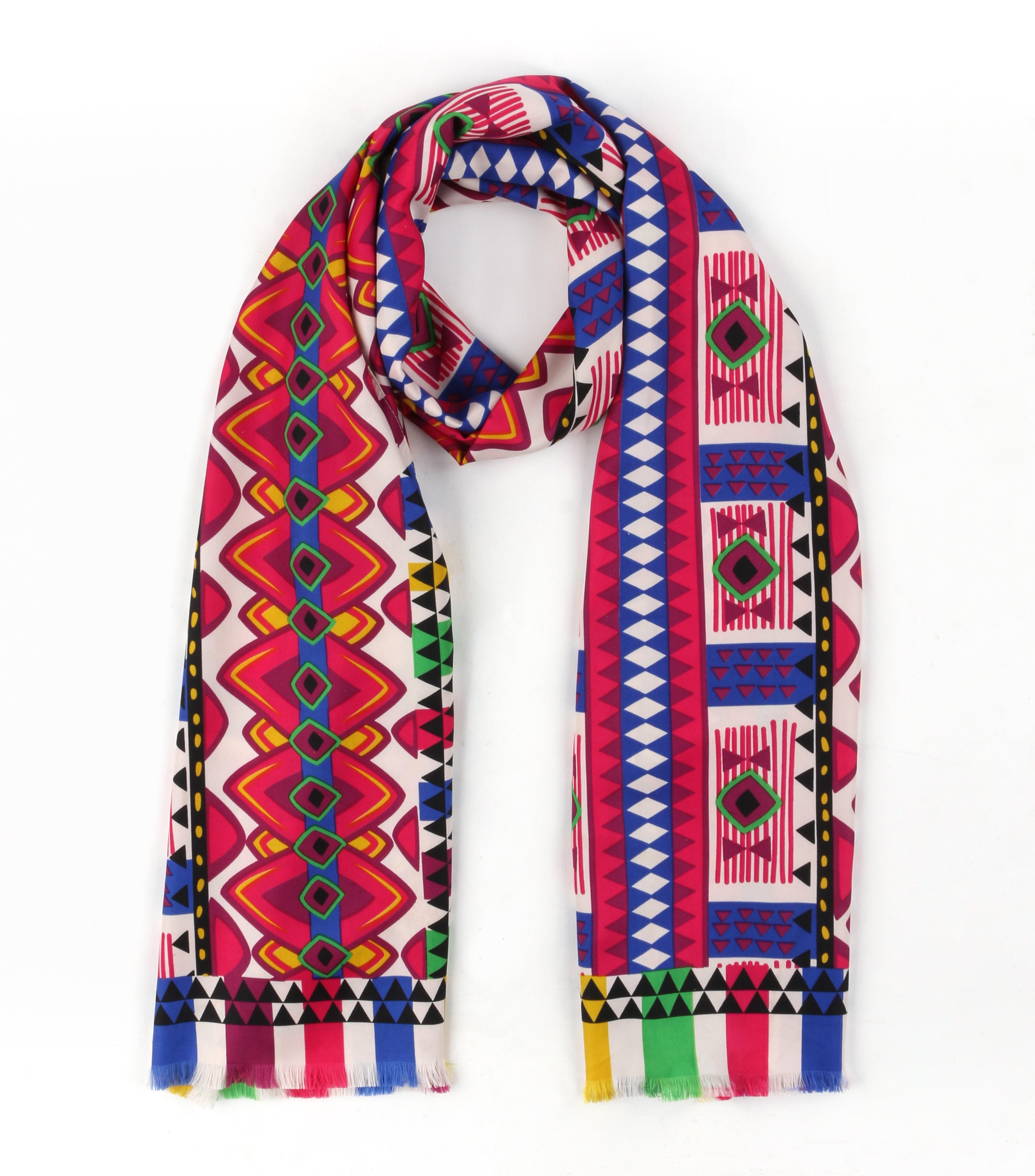 DESCRIPTION: ETRO Multicolor Geometric Tribal Print Silk Fringe Oblong Scarf
 
Brand / Manufacturer: Etro
Style: Oblong scarf
Color(s): Shades of pink, yellow, green, blue, purple, black, and white
Lined: No
Marked Fabric Content: 100% Silk
Unmarked