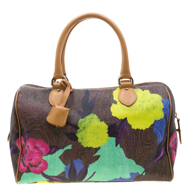 Shaped in paisley-printed coated canvas and leather, this beautiful Etro satchel is both stylish and elegant. Enhanced with colourful, lively prints, this bag is sure to catch attention when you step out with it. Two leather top handles hold this