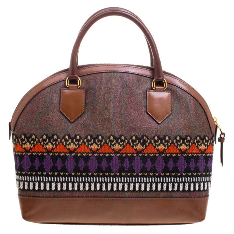Etro is famous for prints, exceptional quality, and their design. This multicolored paisley printed bag is crafted from coated canvas and features crochet detailing. The zip top closure opens to a canvas lined interior that will hold all your daily