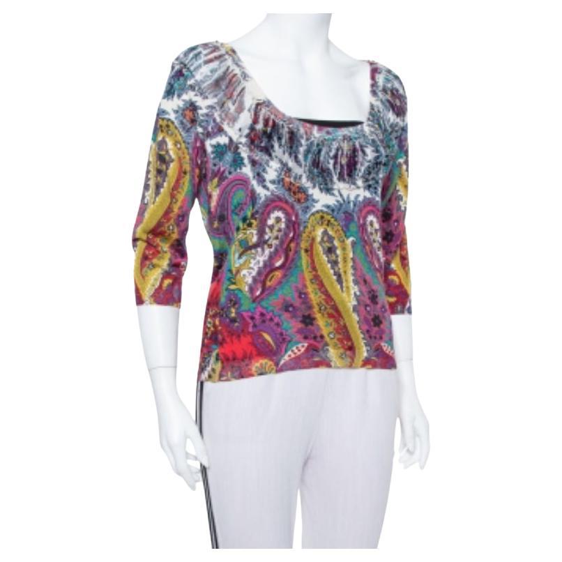 Break the monotony in dressing by pairing this classy Etro top with any bottoms of your choice. Made from silk, it features a vibrant paisley print all over in multiple hues. It is finished off with a round neckline and three-quartered sleeves.