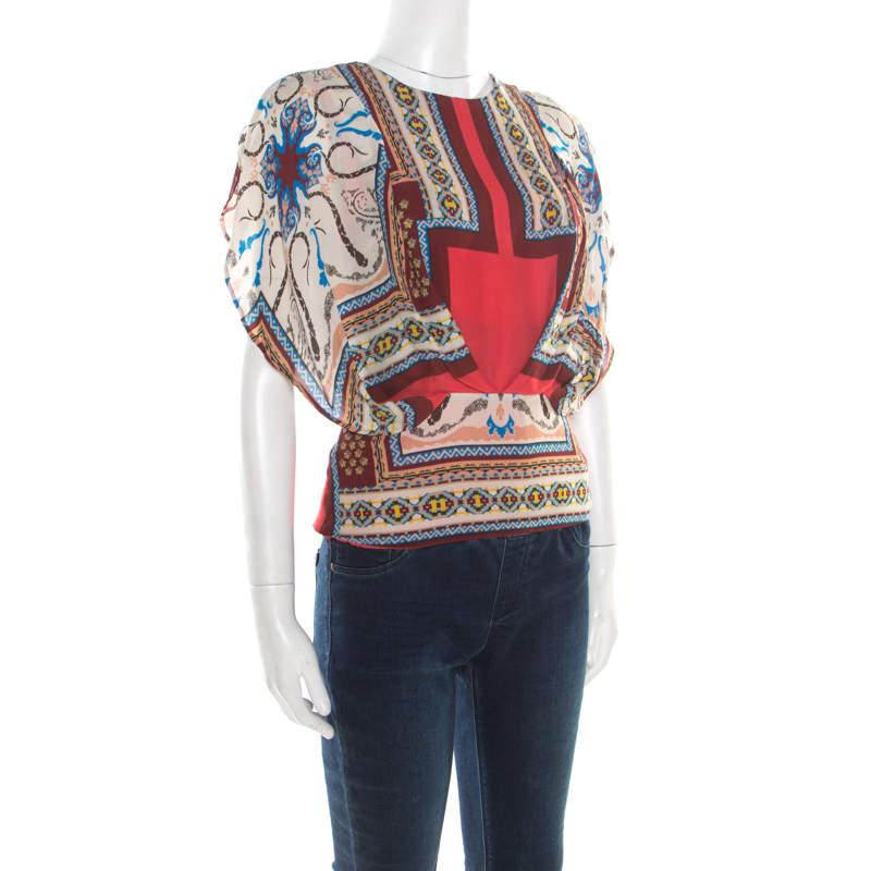 The printed blouson top by Etro embraces a boho-chic look. The multicolor top is finely tailored with silk increasing your comfort and style, and it features gathered details and a back zipper. This top is a must-have.

