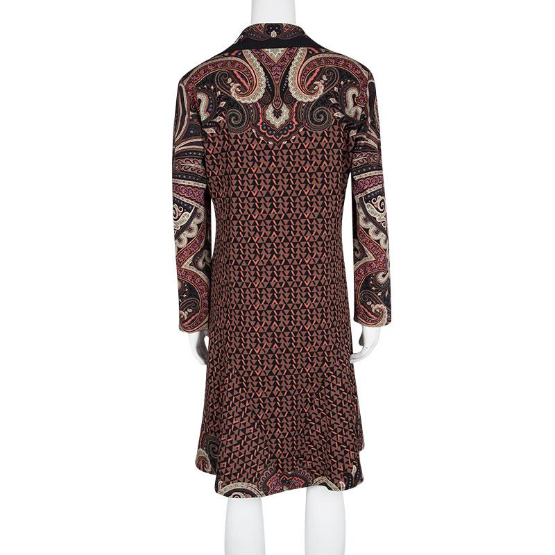 Crafted in wool, this Etro dress features a multicolour print all over. It features a flared bottom and comes with long sleeves. Detailed with a V-neckline, this dress makes an apt choice for social events or parties. Complete the look with a